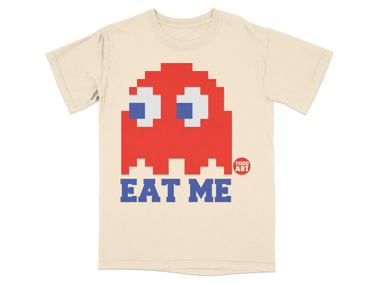 Cream t-shirt with red Pac-Man ghost and "EAT ME" text.