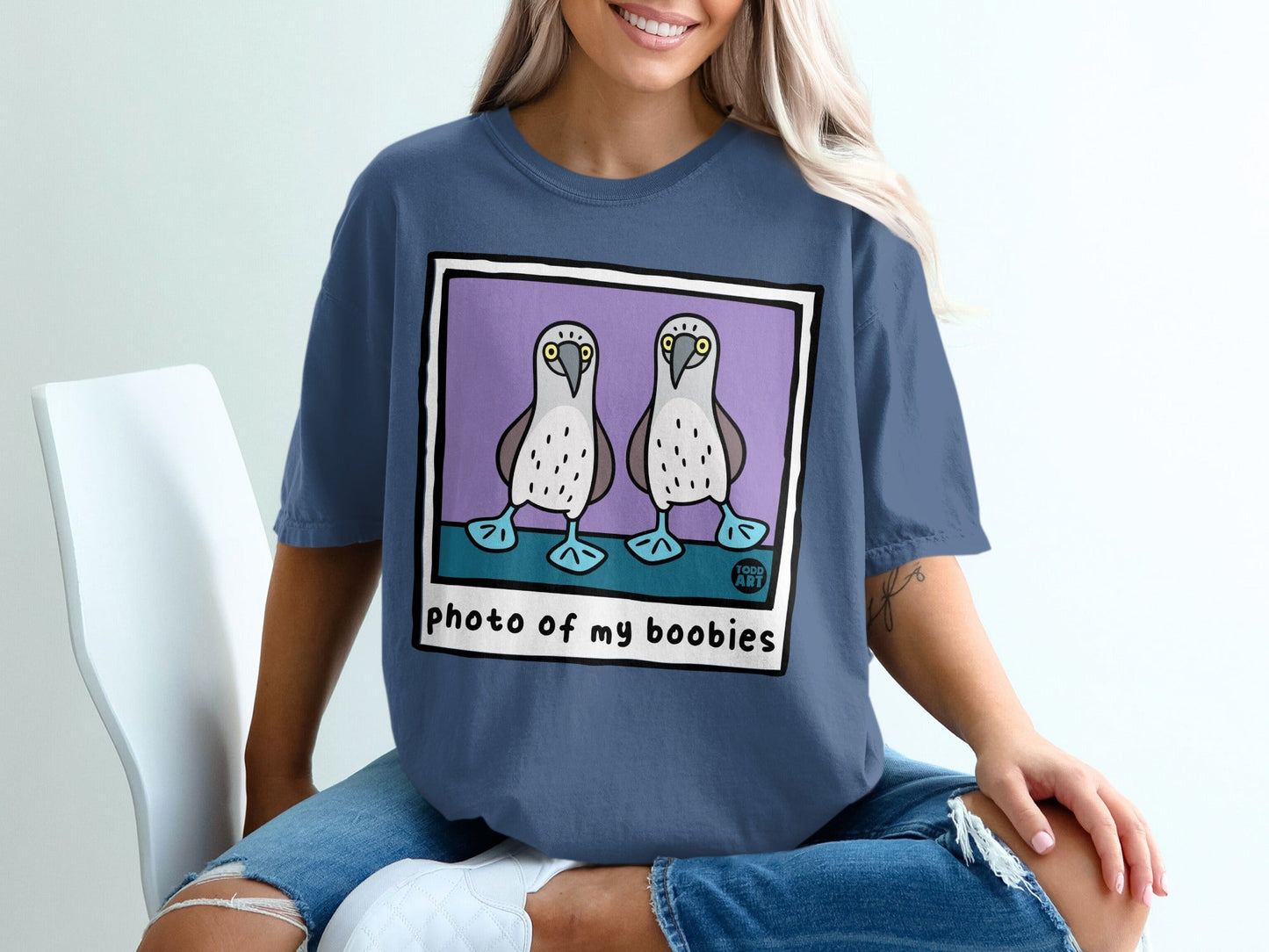 T-shirt with a cartoon illustration of two blue-footed boobies and text that says "photo of my boobies".