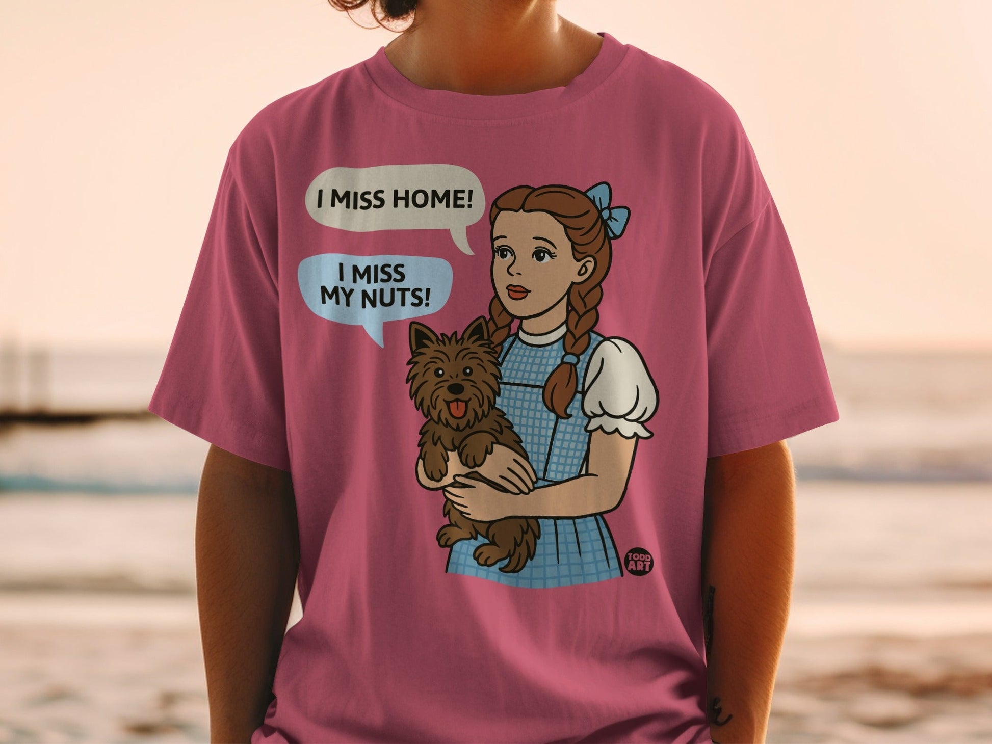 Dorothy from The Wizard of Oz holding Toto, text says "I miss home! I miss my nuts!".