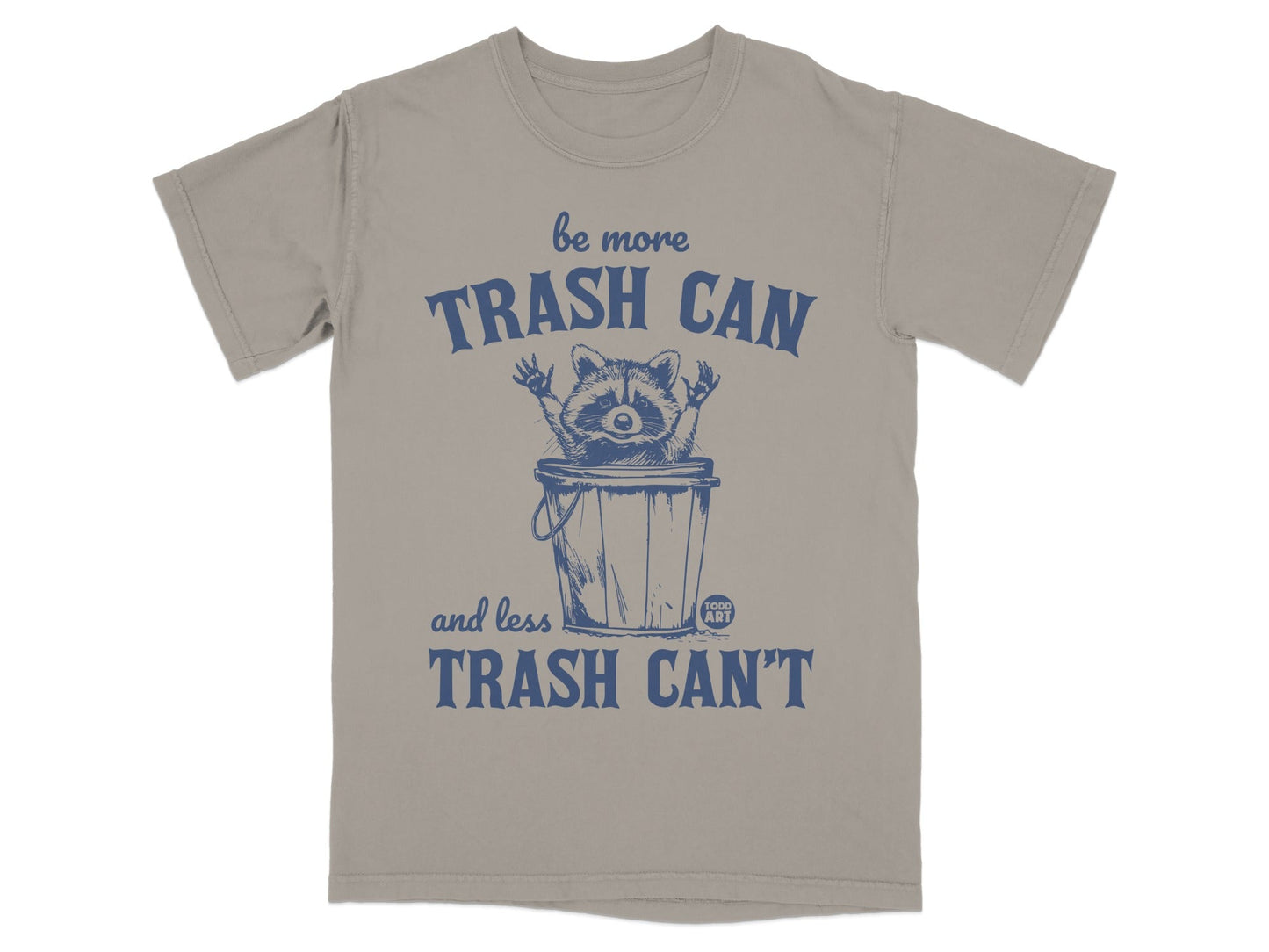 T-shirt graphic with raccoon in trash can, "be more trash can and less trash can't" text.