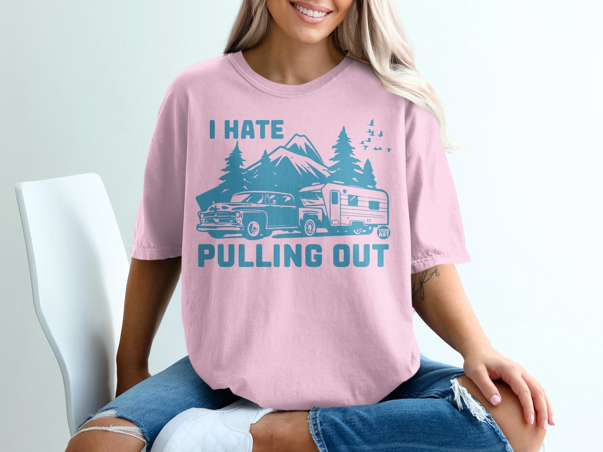 Pink t-shirt with "I Hate Pulling Out" text and graphic of a truck and camper.