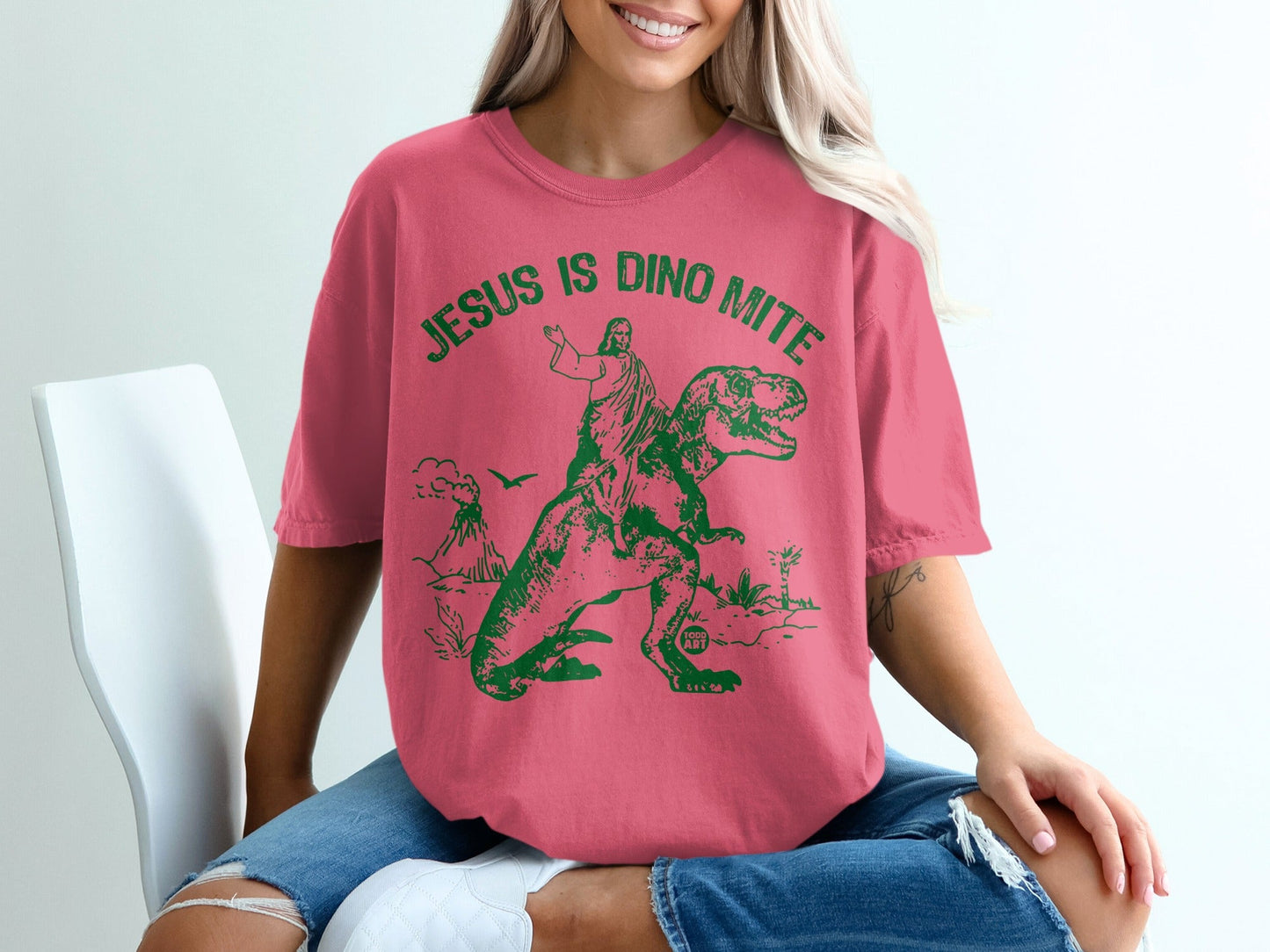 Jesus on a dinosaur with "Jesus is Dino Mite" text.