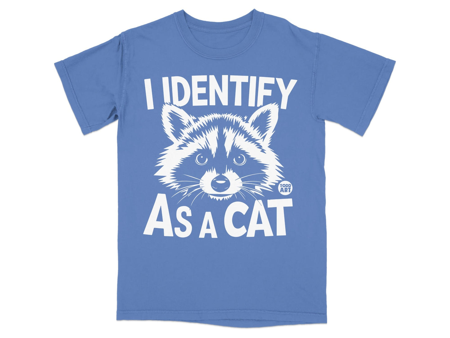 Blue t-shirt with white text and a raccoon face that reads "I IDENTIFY AS A CAT".