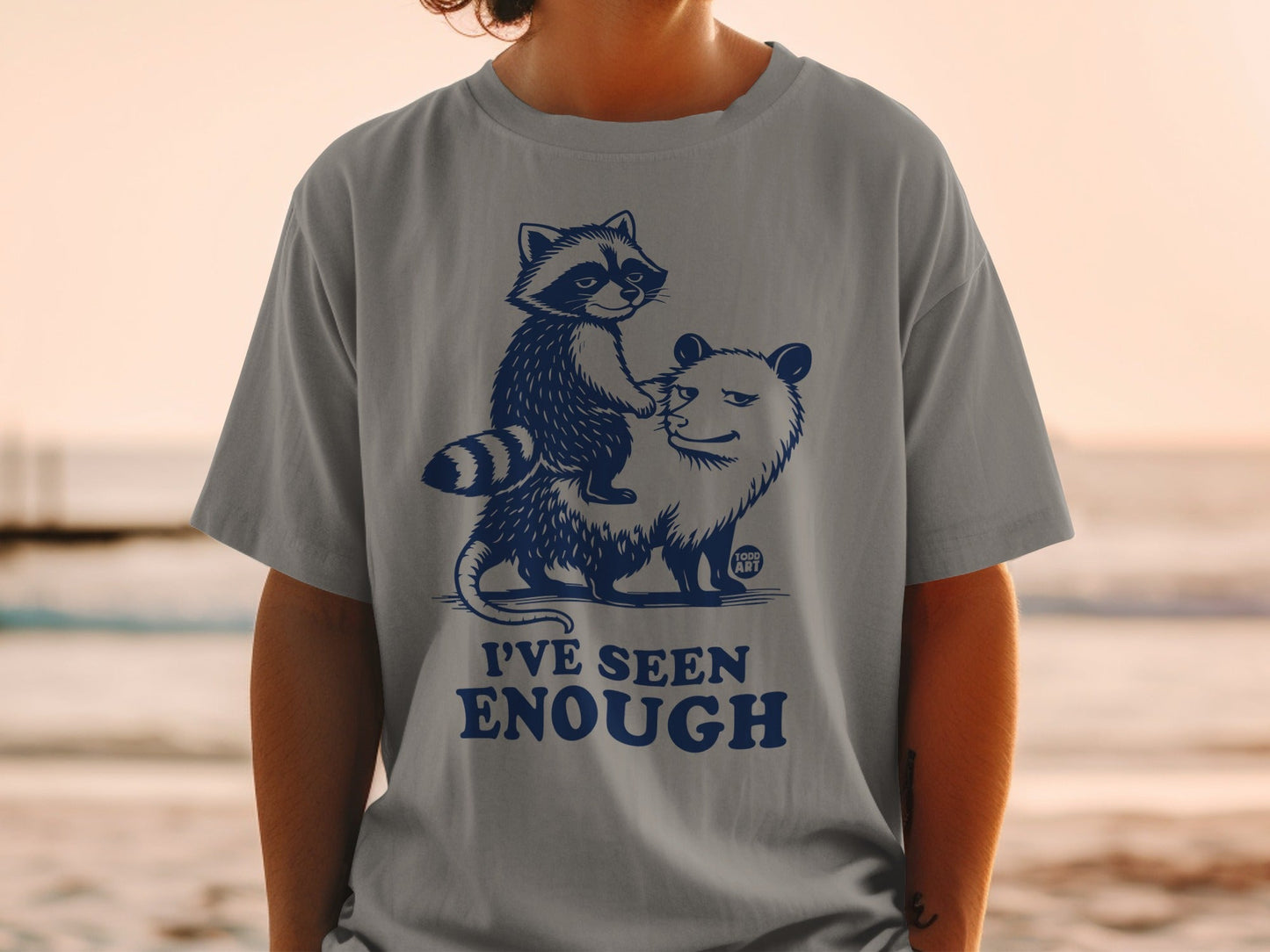 T-shirt with a raccoon riding an opossum, "I'VE SEEN ENOUGH" text.