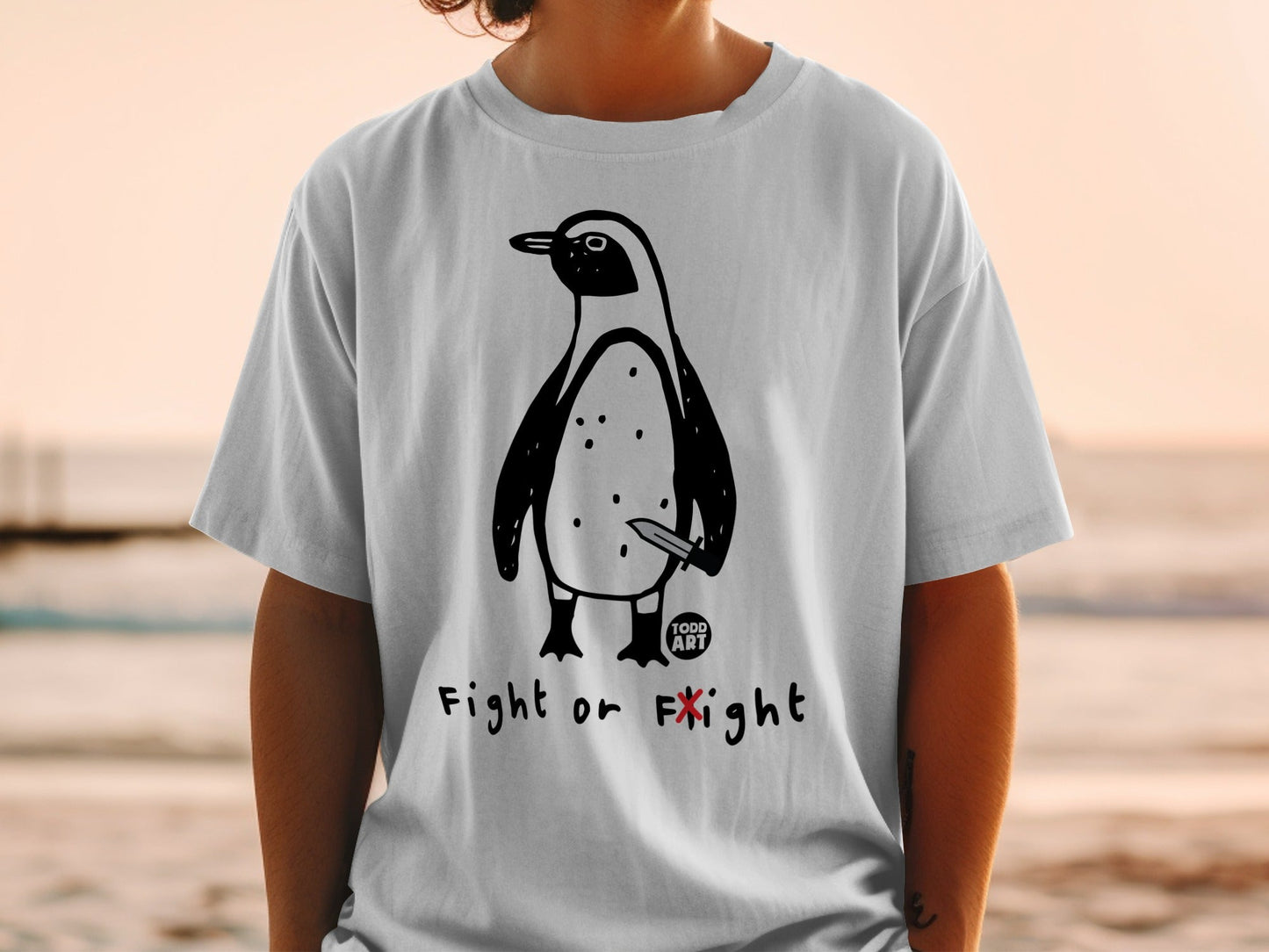T-shirt with cartoon penguin holding a knife and text "Fight or Flight".