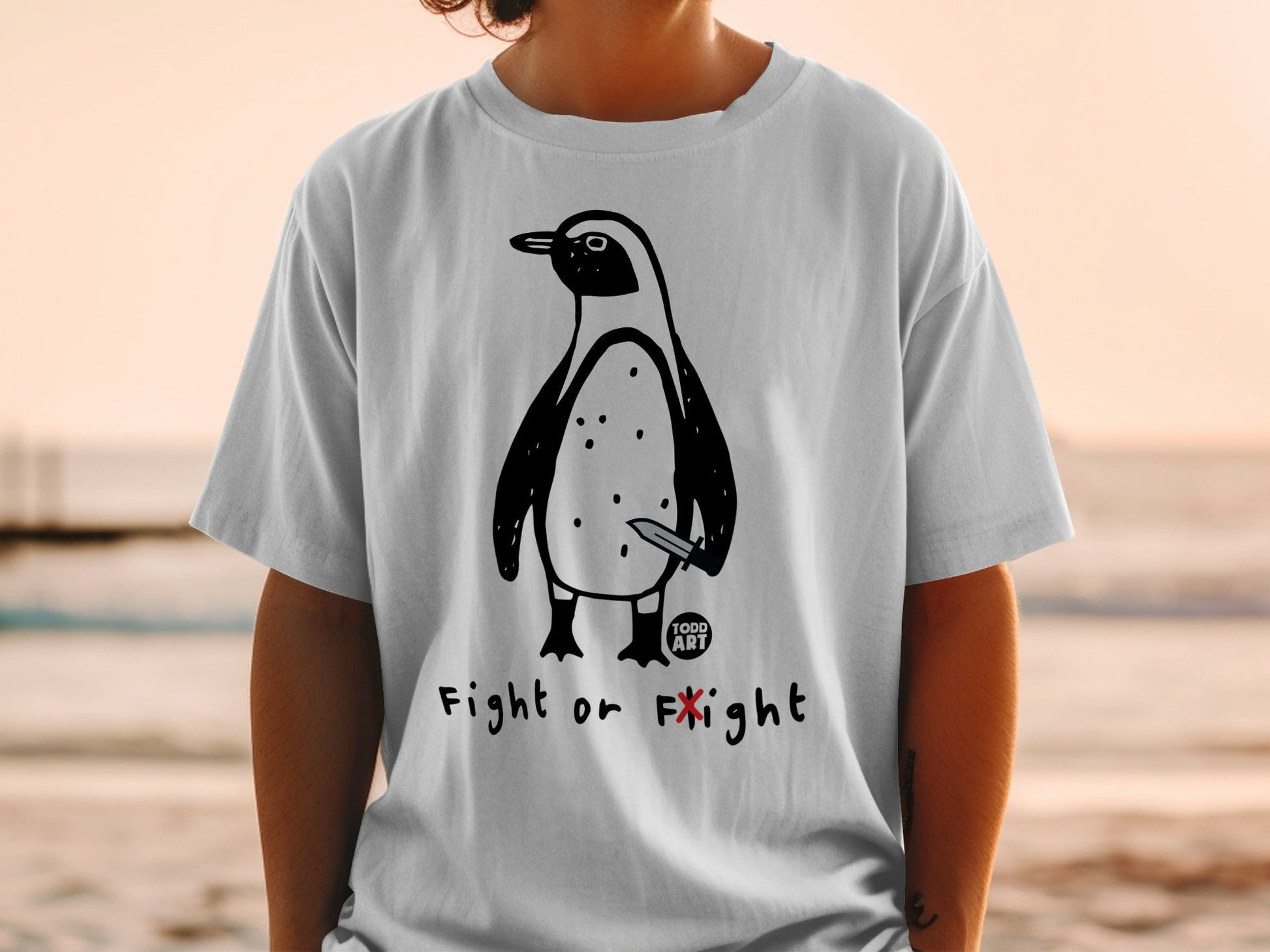 T-shirt with cartoon penguin holding a knife and text "Fight or Flight".