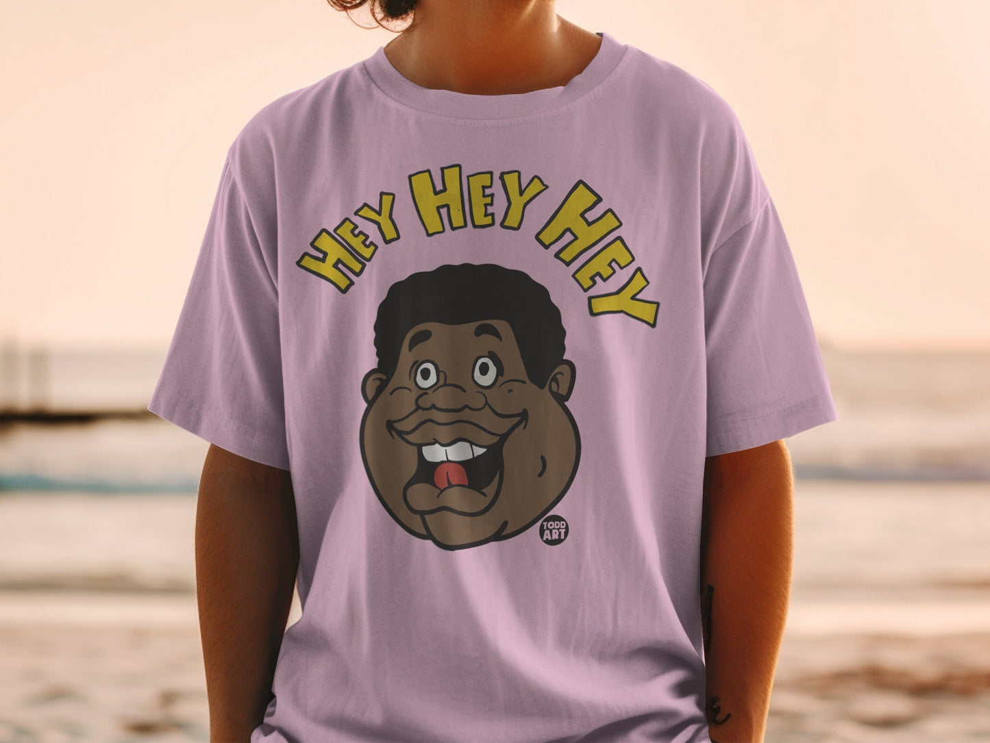 Pink t-shirt with cartoon face and "HEY HEY HEY" text.