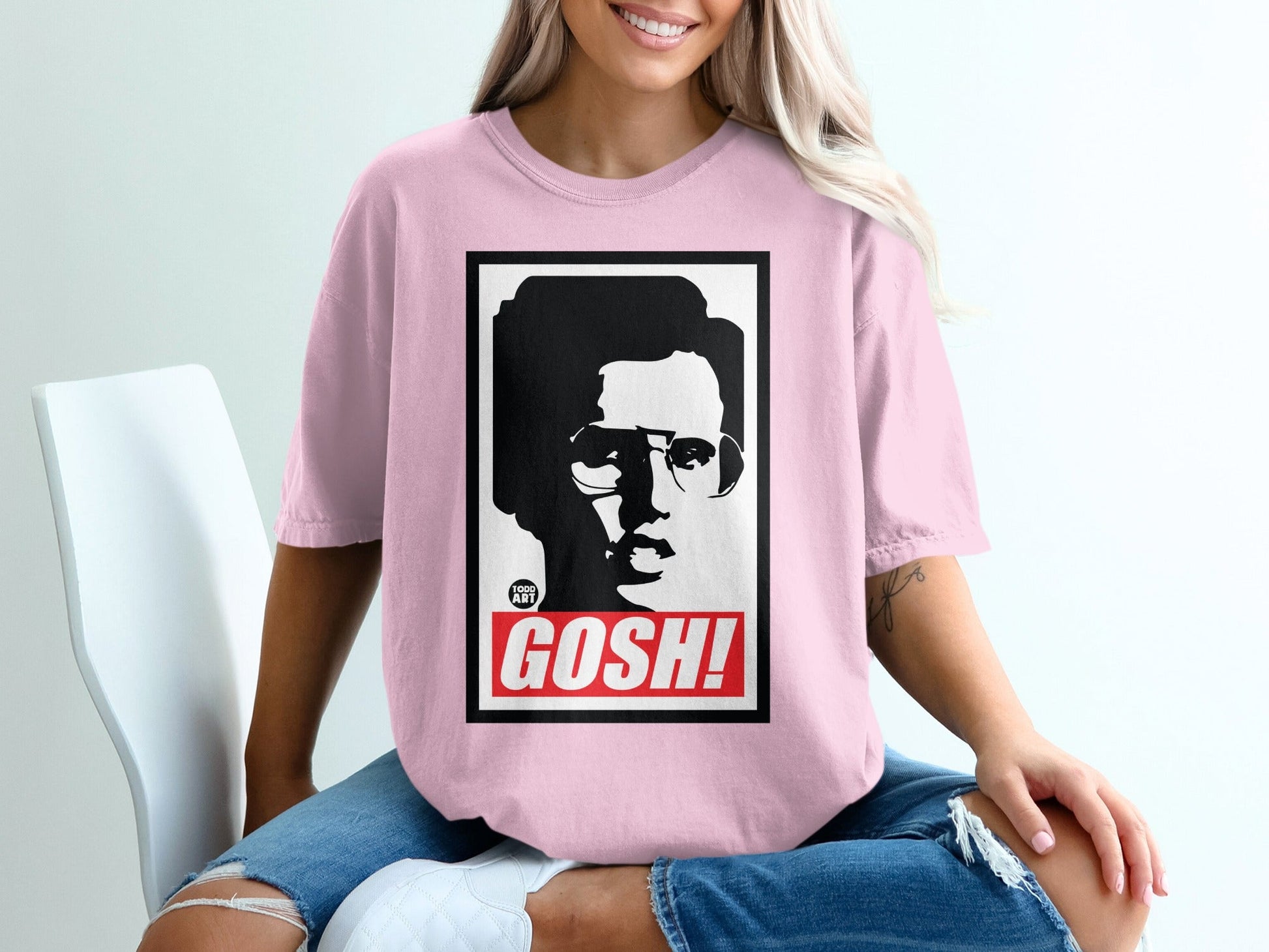 Pink t-shirt with black and white portrait and "GOSH!" text.