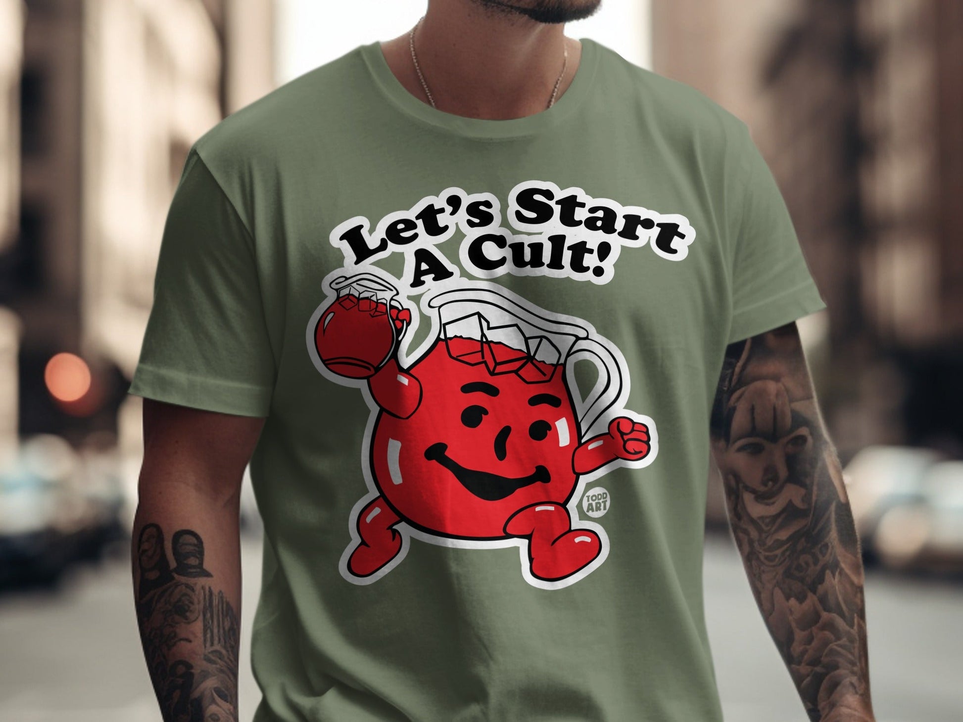 Kool-Aid Man wearing a t-shirt that says "Let's Start A Cult!".