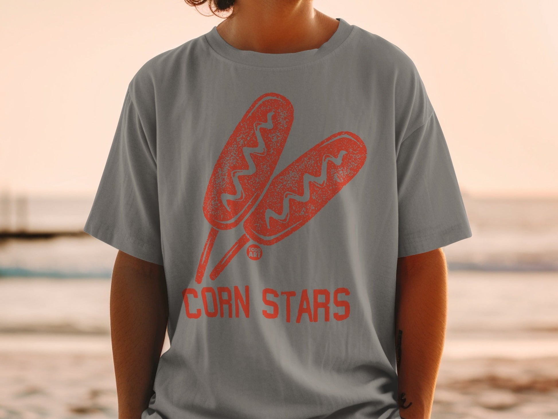 Gray t-shirt with graphic of two corn dogs and text "CORN STARS".