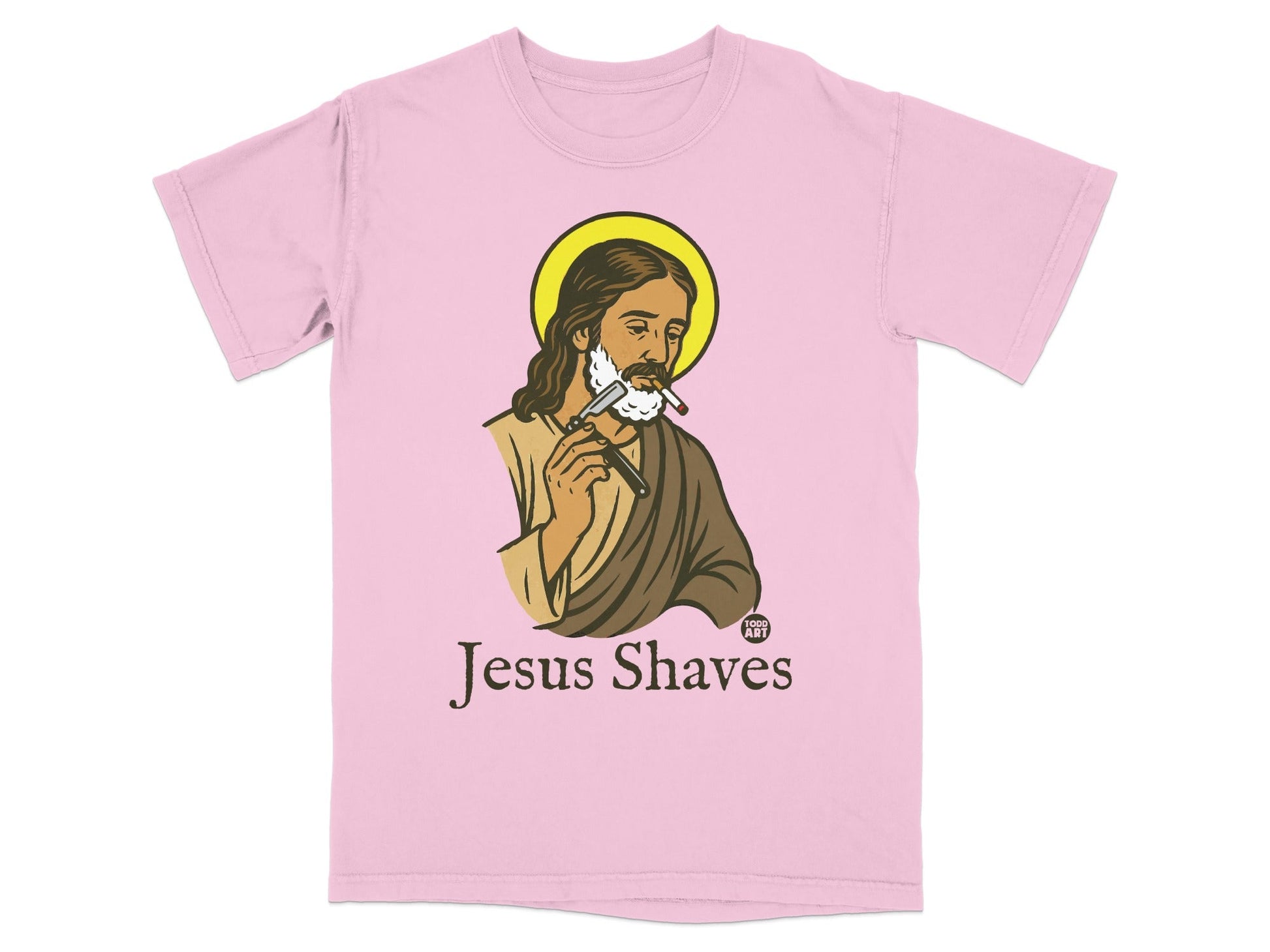 Jesus shaving, halo, "Jesus Shaves" text, on a pink t-shirt.