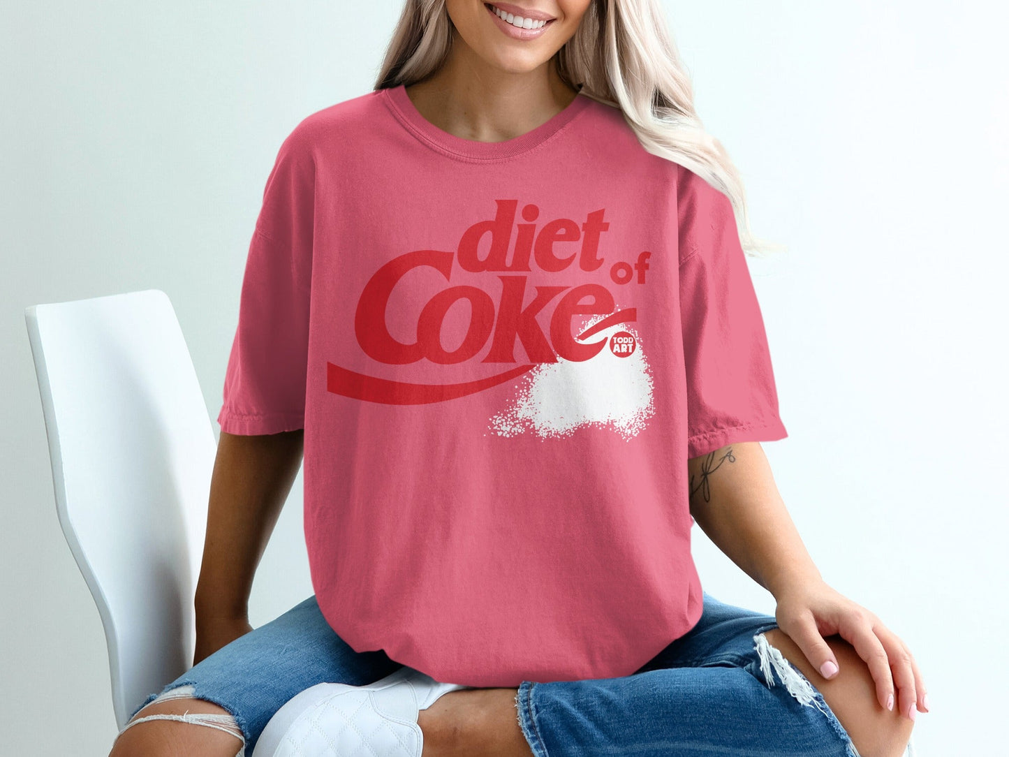 Diet Coke t-shirt with red logo and white powder graphic.