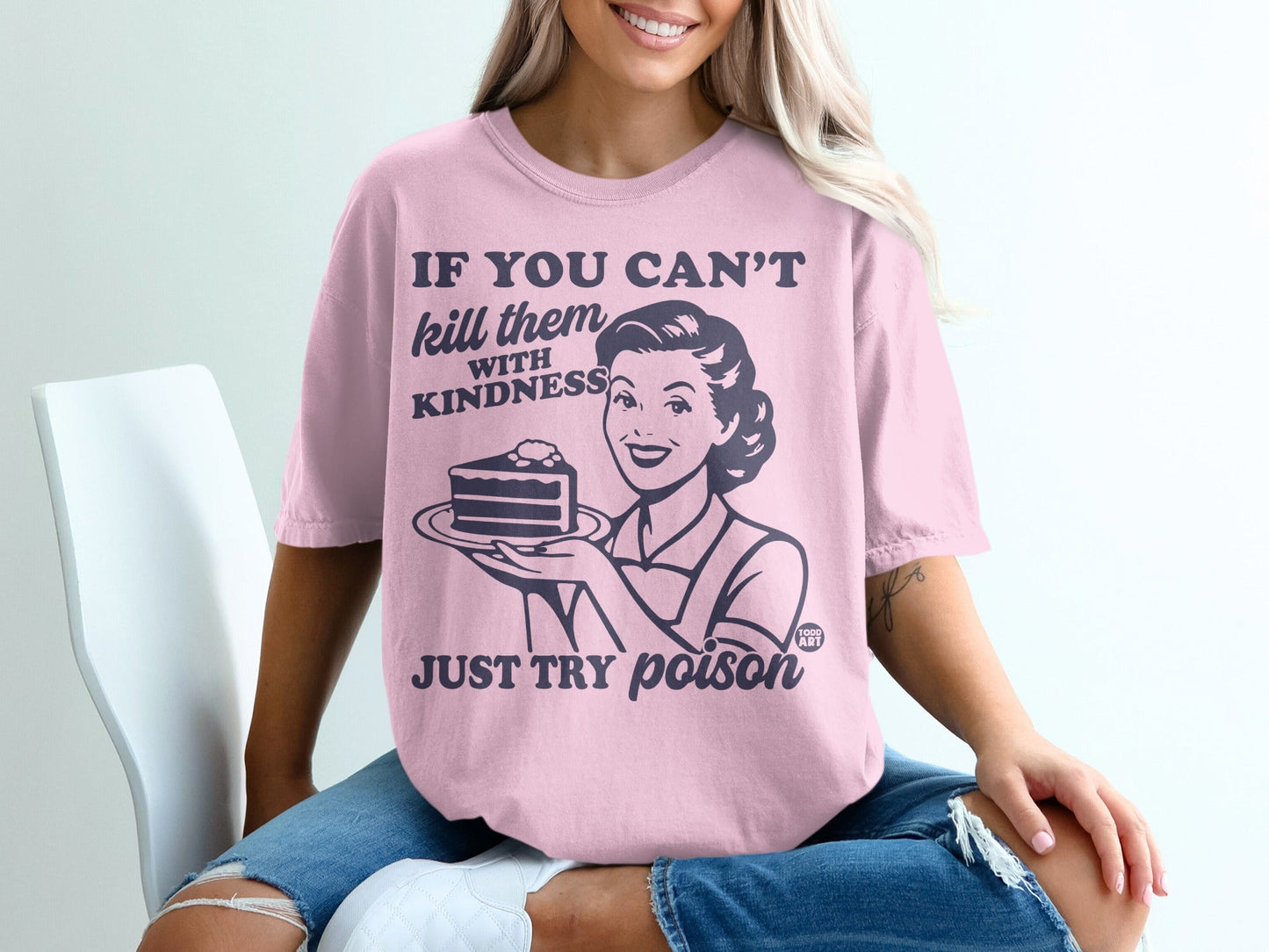 Pink t-shirt with retro woman holding cake and text "If you can't kill them with kindness, just try poison."