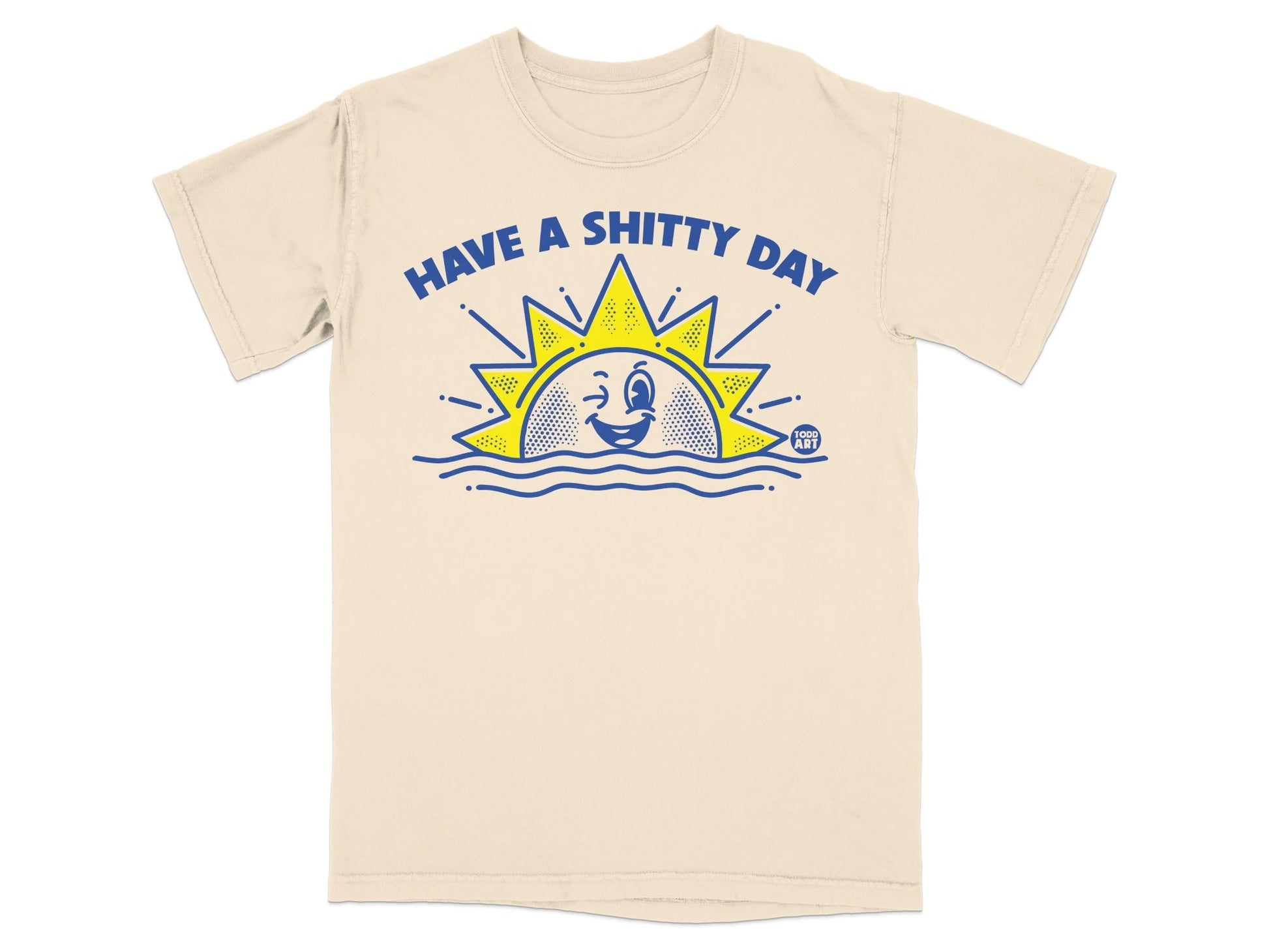 Cream t-shirt with "HAVE A SHITTY DAY" text and a winking sun graphic.