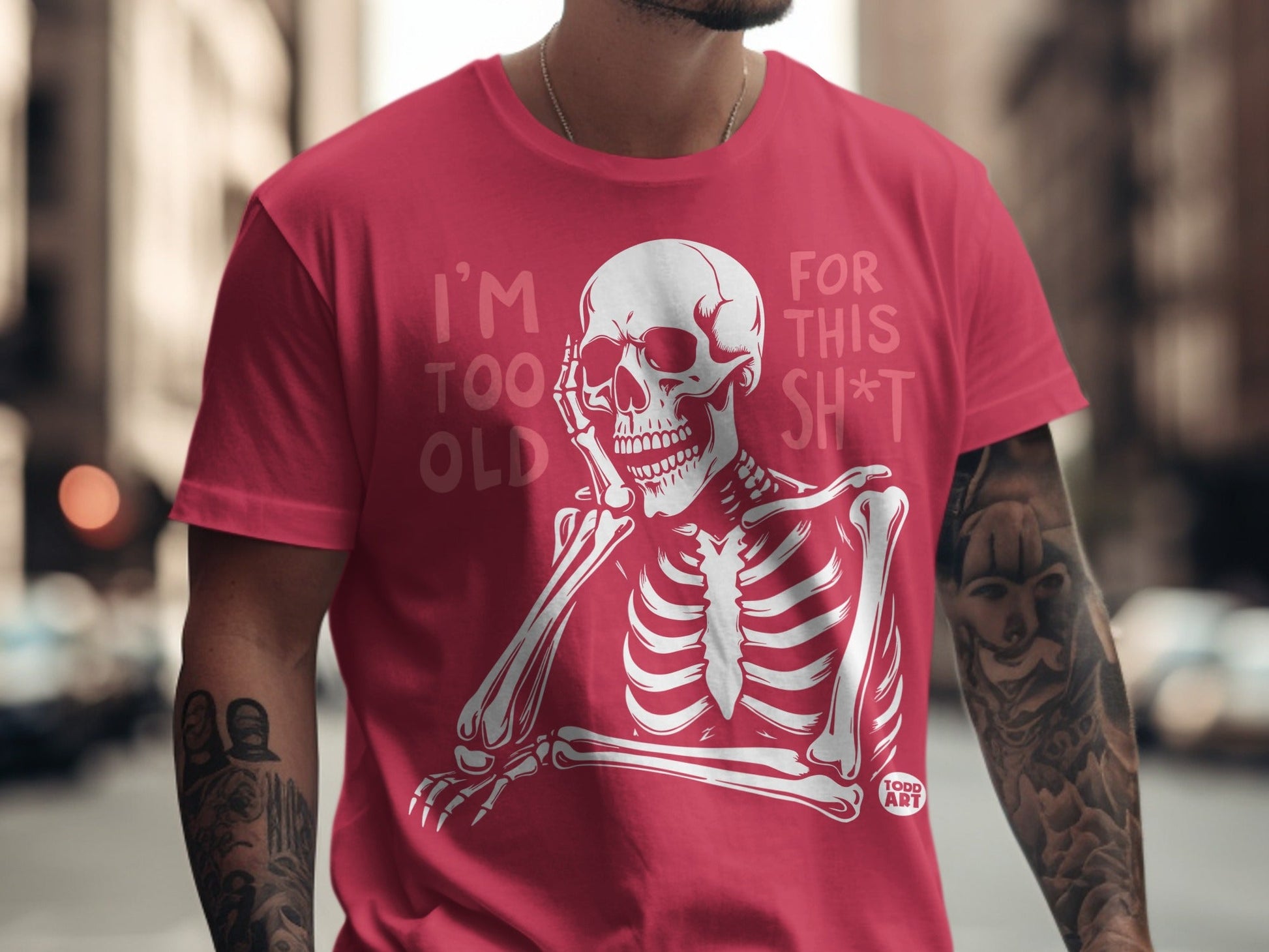 Red t-shirt with skeleton graphic and text "I'm too old for this sh*t".
