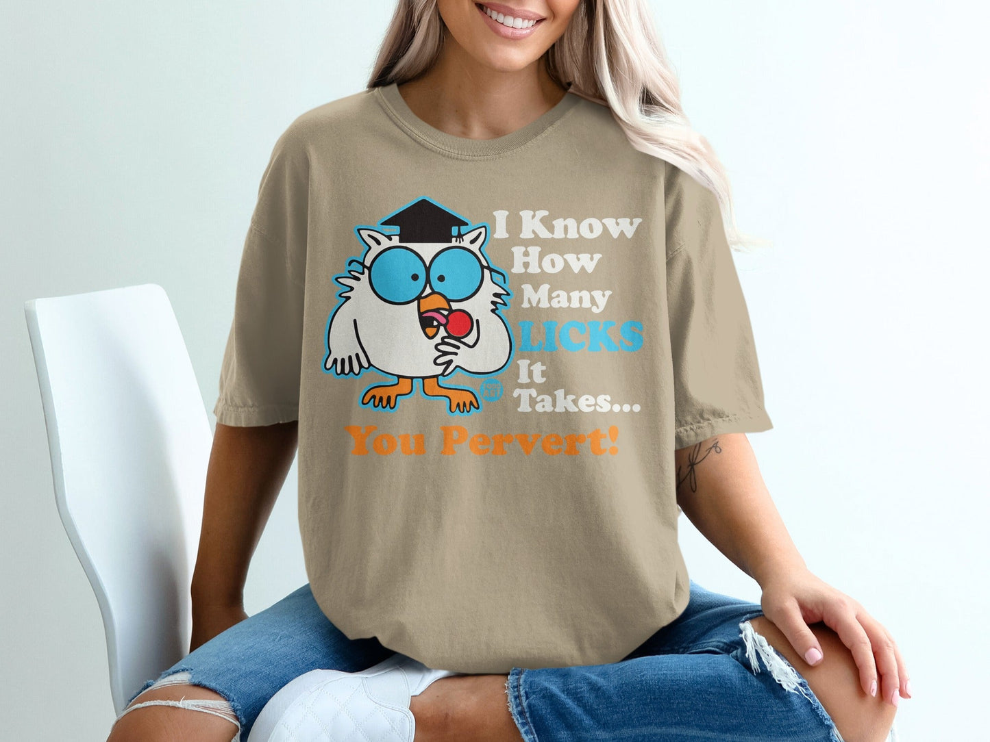 Owl graphic with text "I Know How Many Licks It Takes... You Pervert!" on a tan t-shirt.