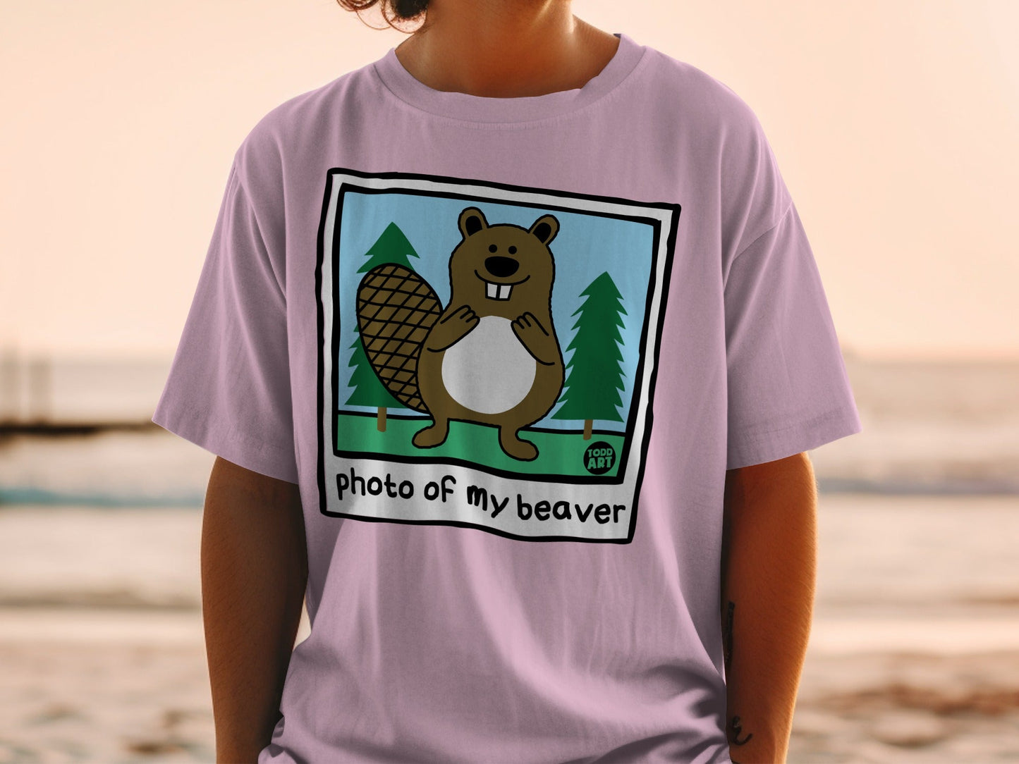 Illustration of a beaver in a frame on a t-shirt that reads "photo of my beaver".