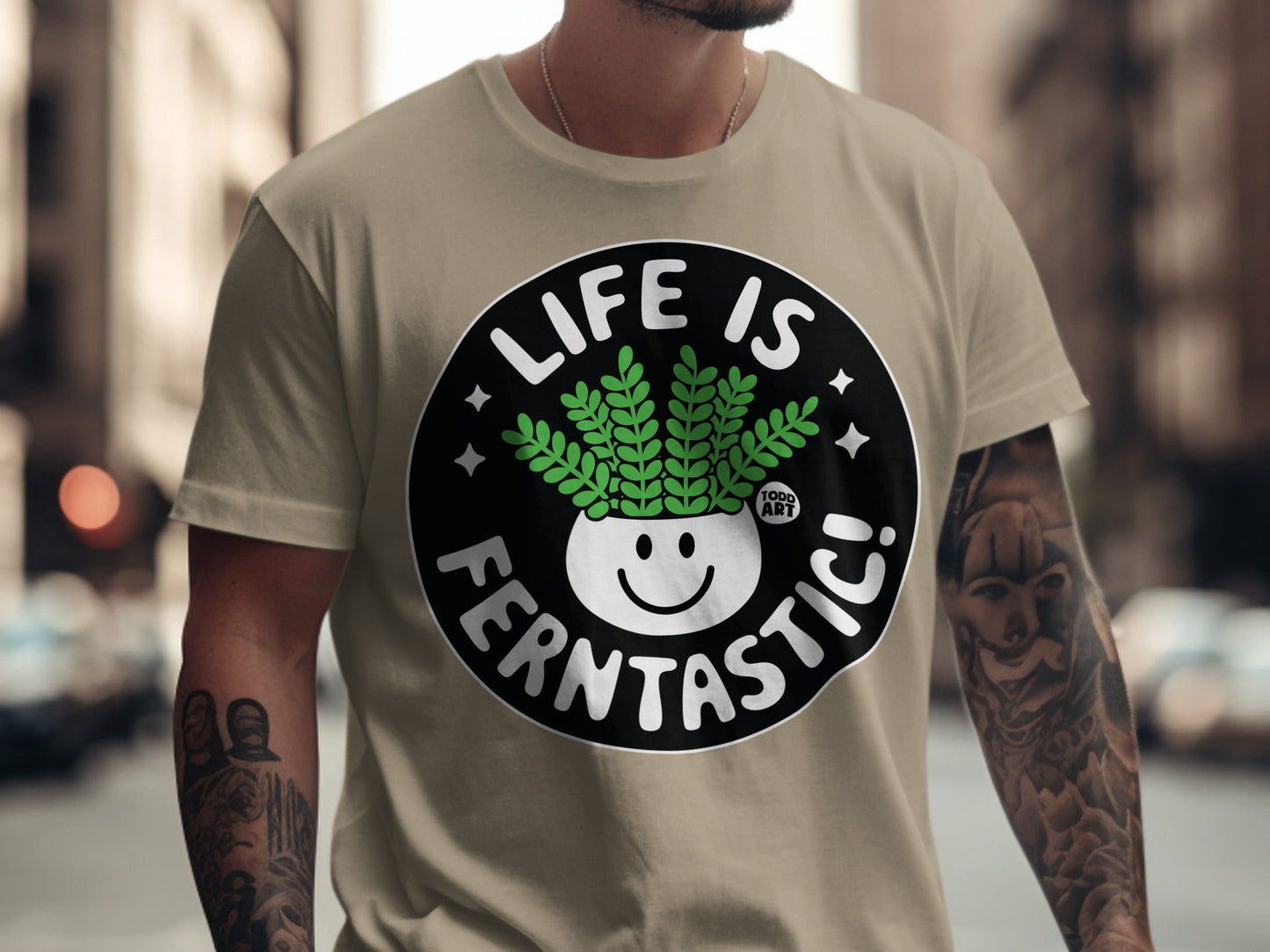 T-shirt with "Life is Ferntastic!" text and a smiling potted fern.