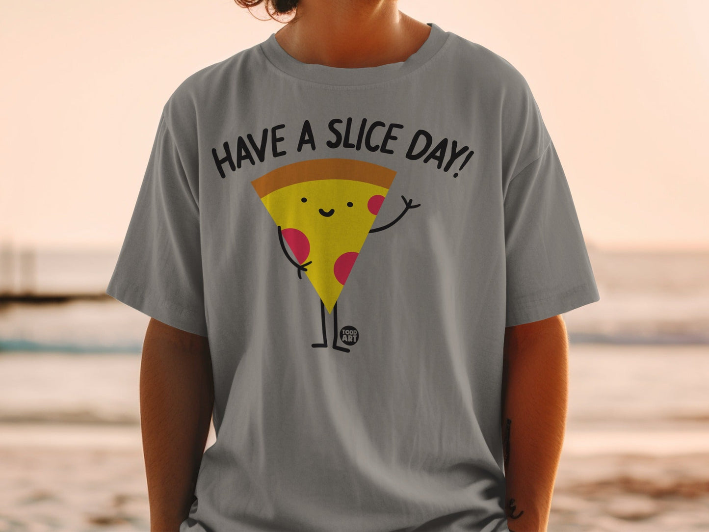 T-shirt with a cartoon pizza slice waving and the text "HAVE A SLICE DAY!"