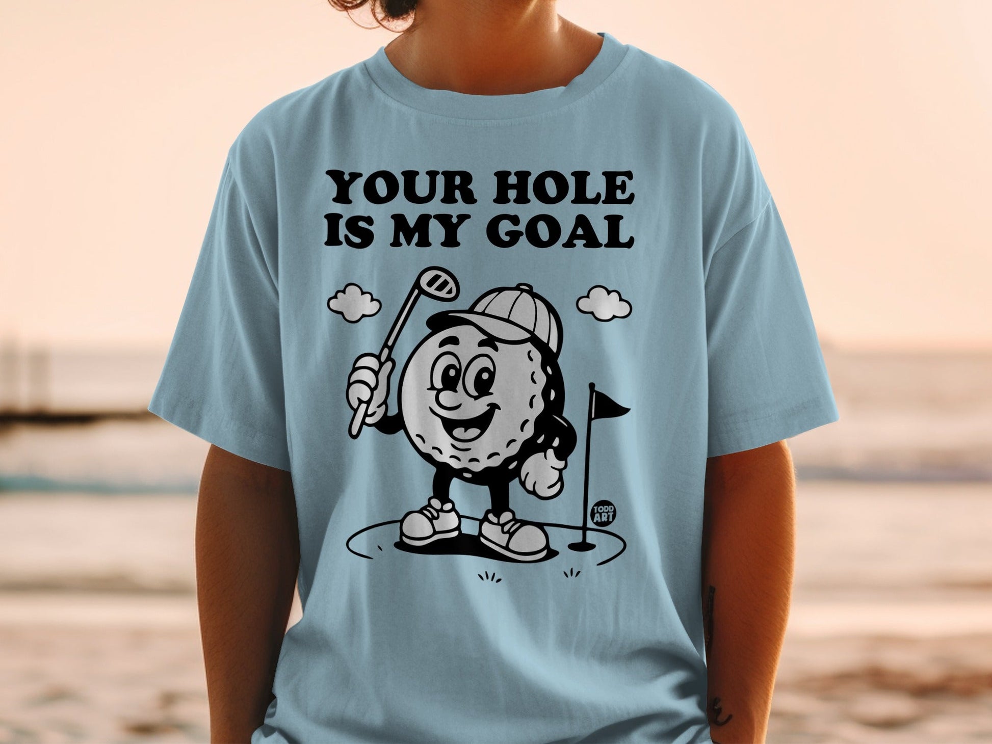 Cartoon golf ball with a club and text "YOUR HOLE IS MY GOAL".