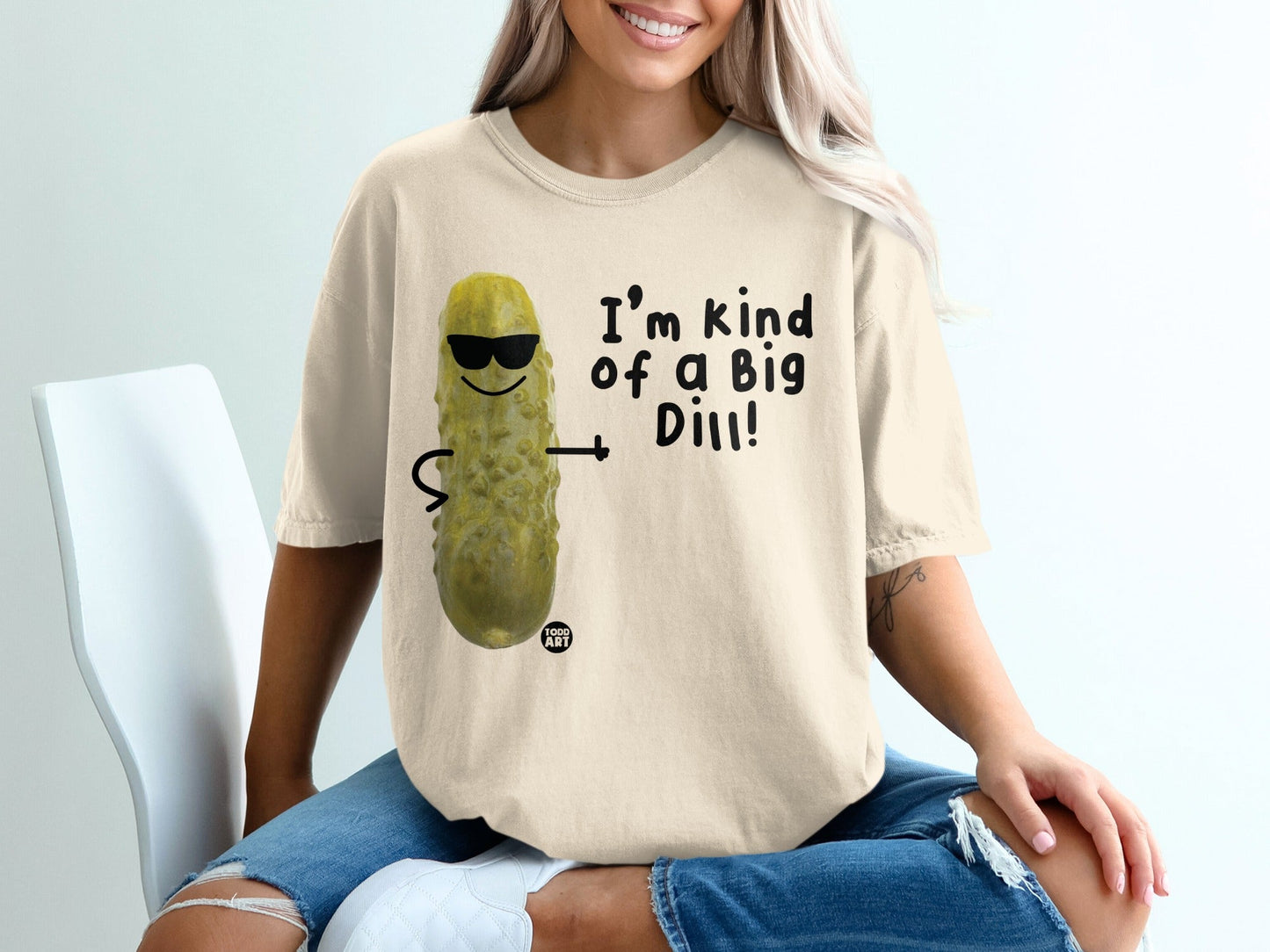 Cream t-shirt with a pickle wearing sunglasses and text "I'm kind of a big dill!".