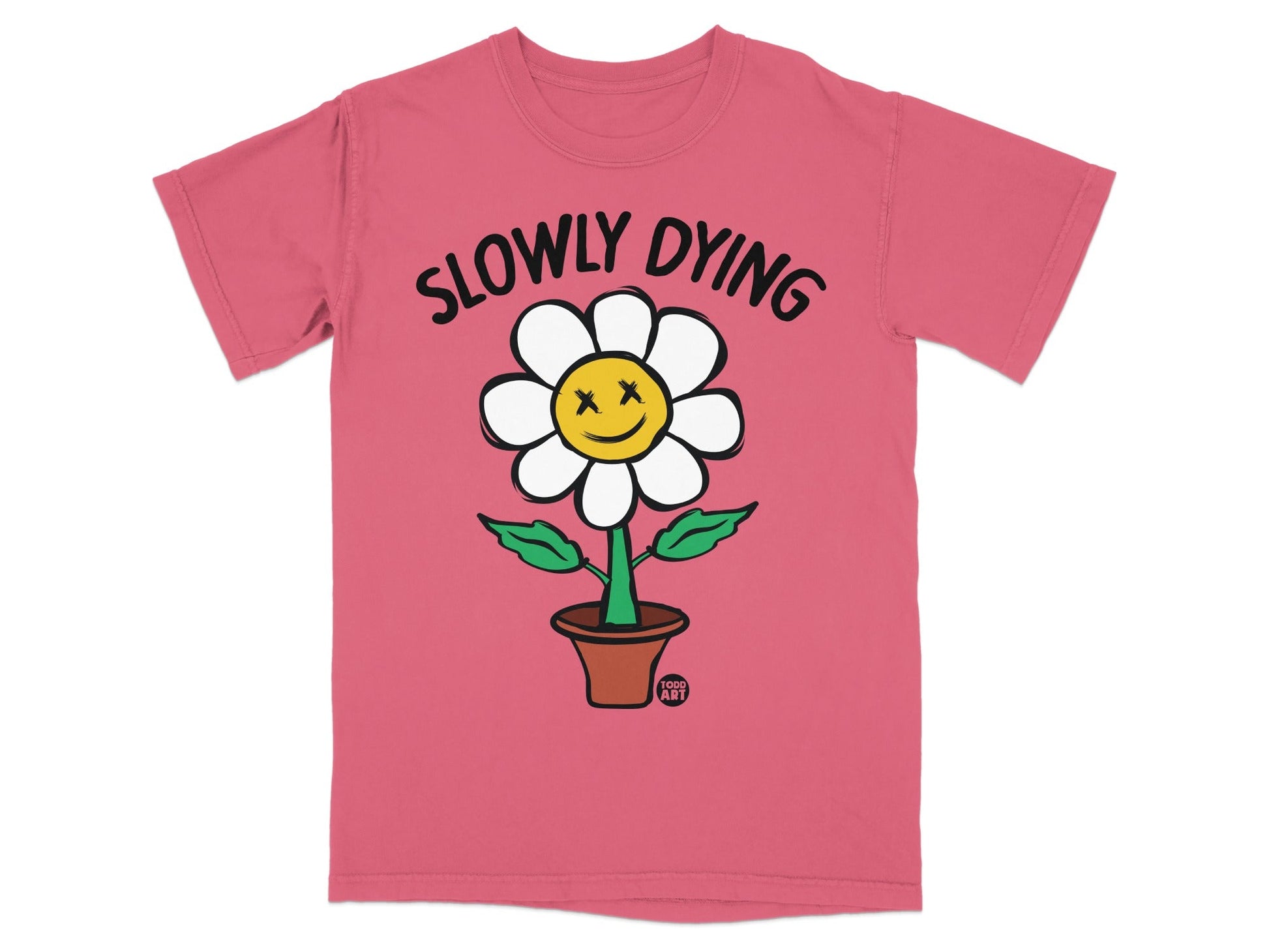 Pink t-shirt with a cartoon flower with a smiley face that says "SLOWLY DYING".