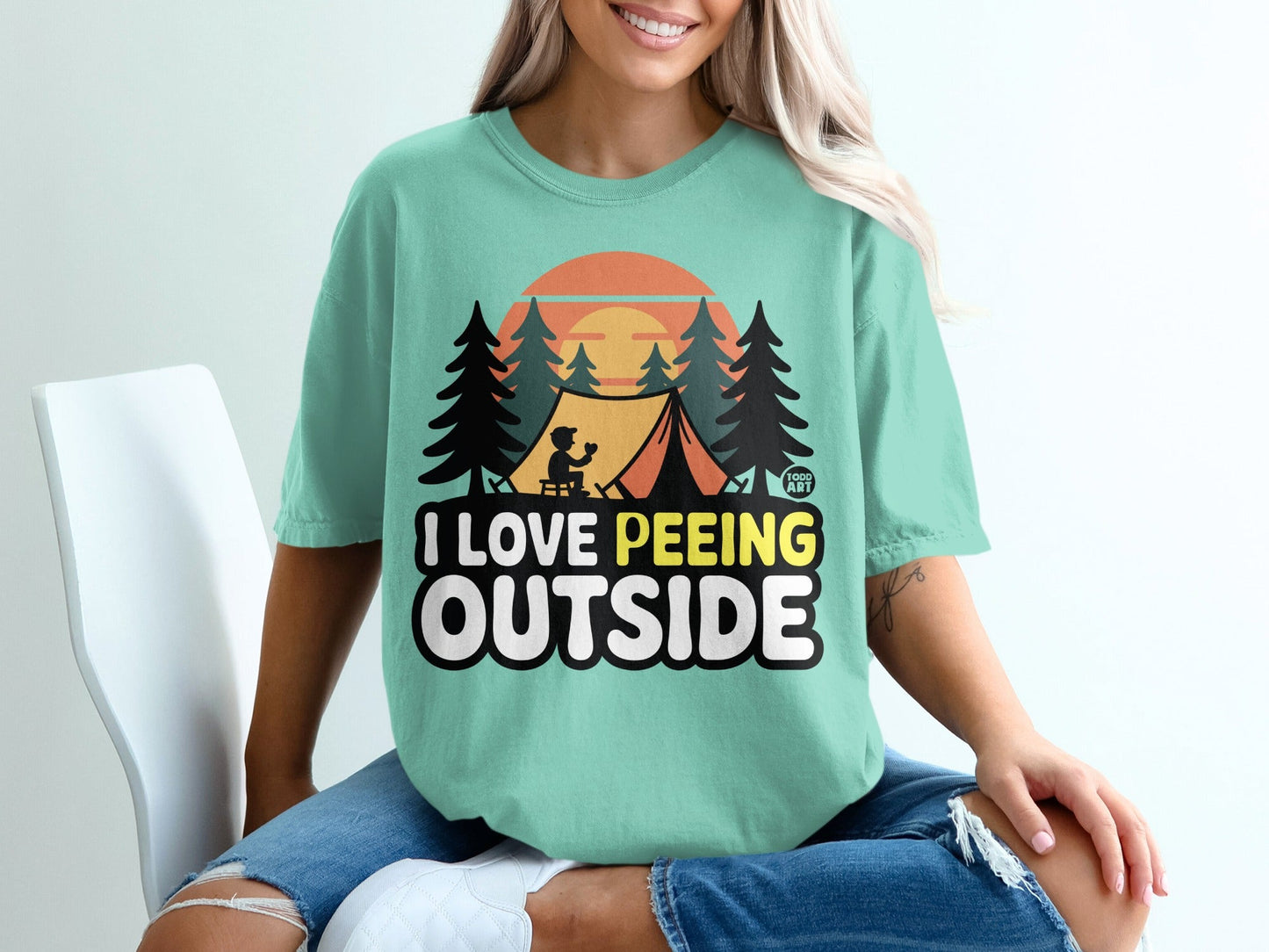 T-shirt with "I LOVE PE**ING OUTSIDE" text and camping graphic.