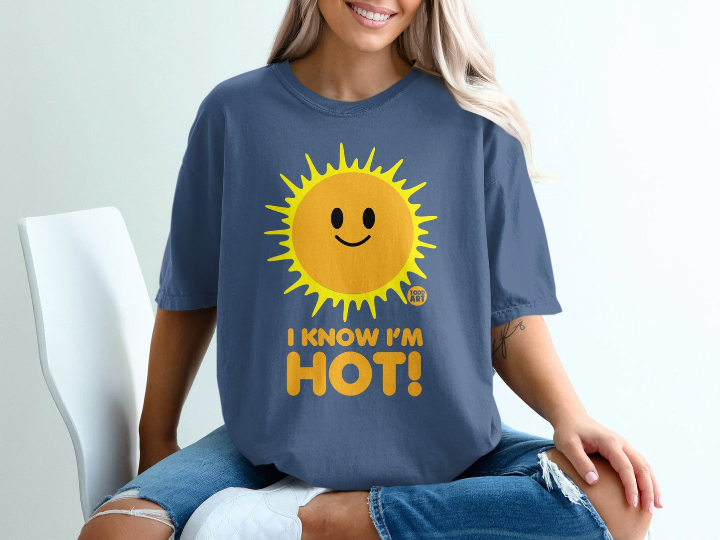 Blue t-shirt with a smiling sun graphic and "I KNOW I'M HOT!" text.