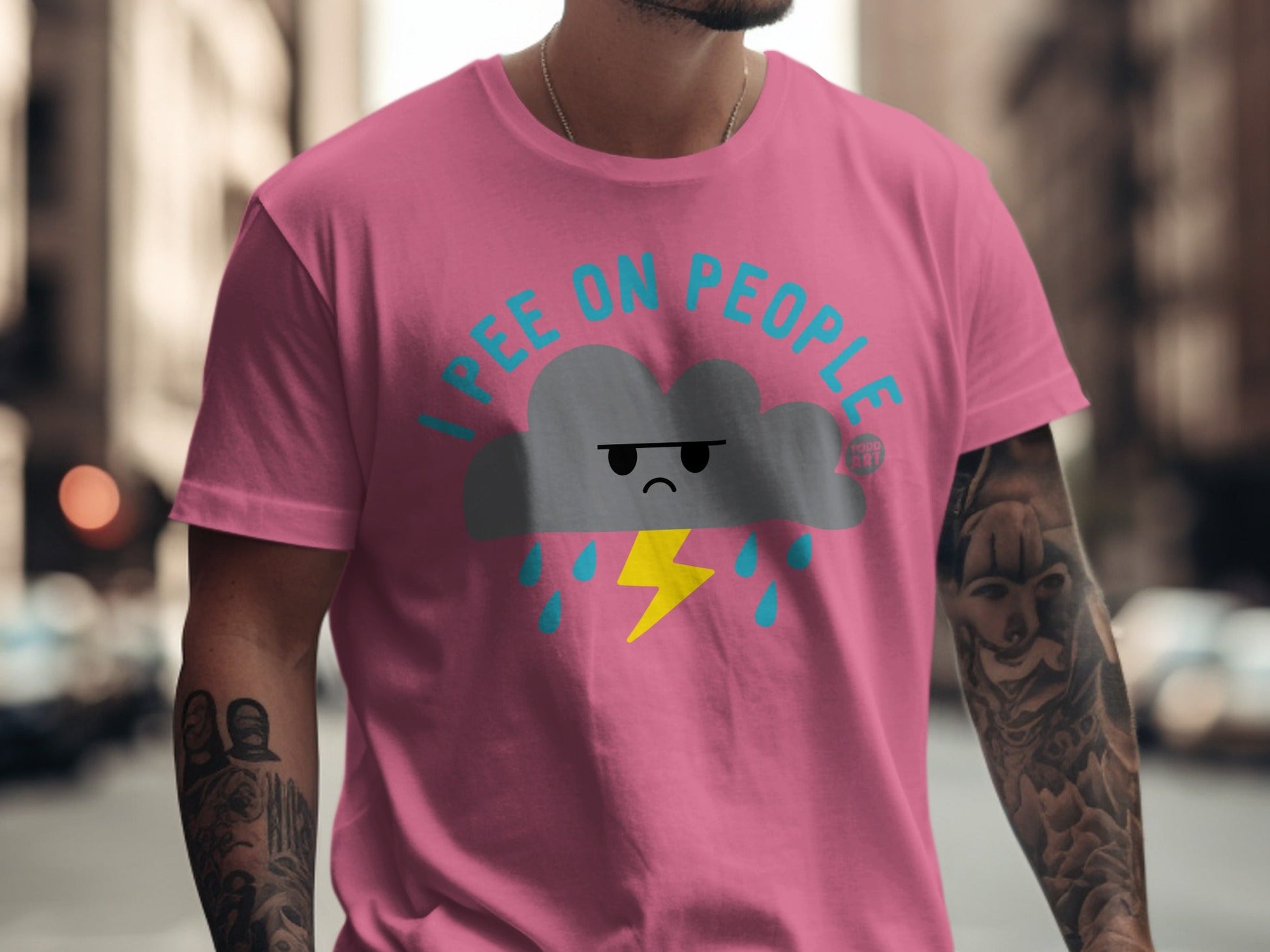 Pink t-shirt with "I pee on people" text and cartoon cloud with lightning.