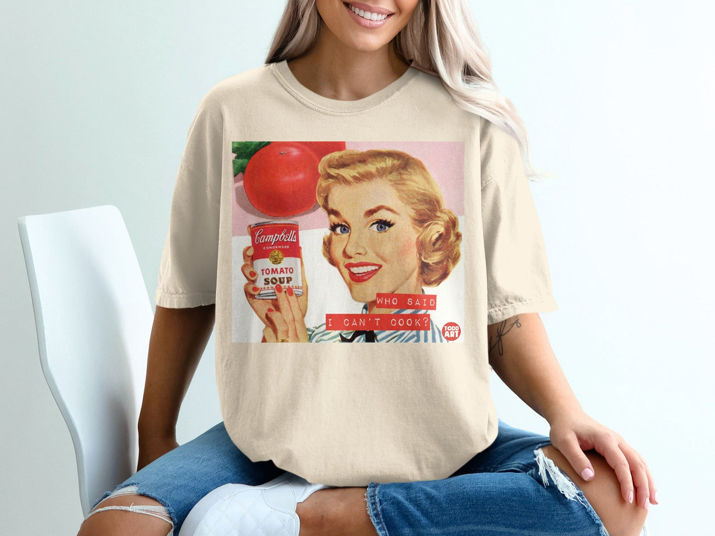 Retro woman holding Campbell's soup can, "Who said I can't cook?"