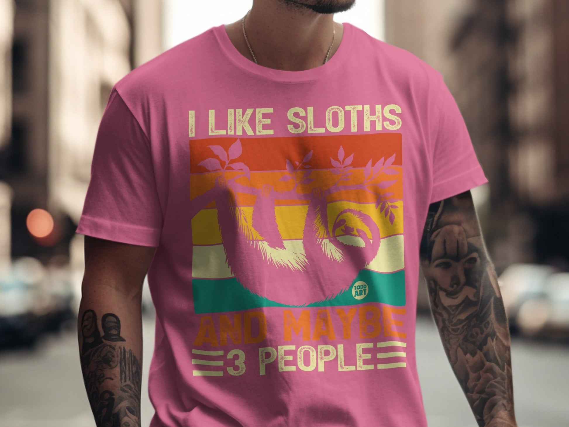 Pink t-shirt with a sloth graphic and text "I LIKE SLOTHS AND MAYBE 3 PEOPLE".