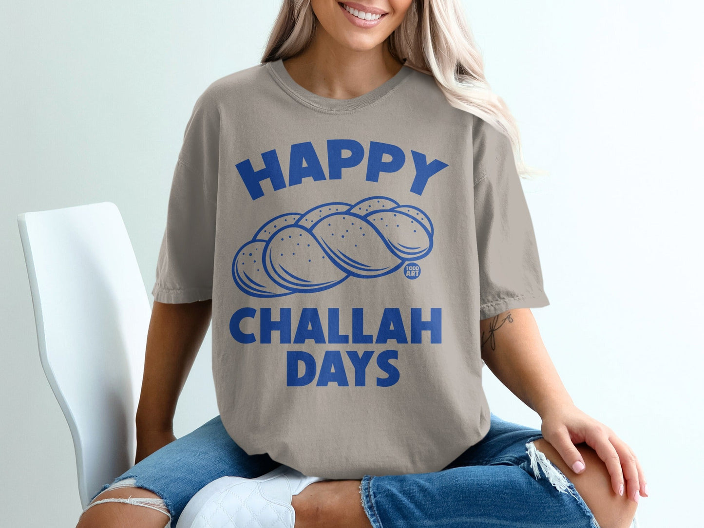 T-shirt with "Happy Challah Days" and braided challah bread design.