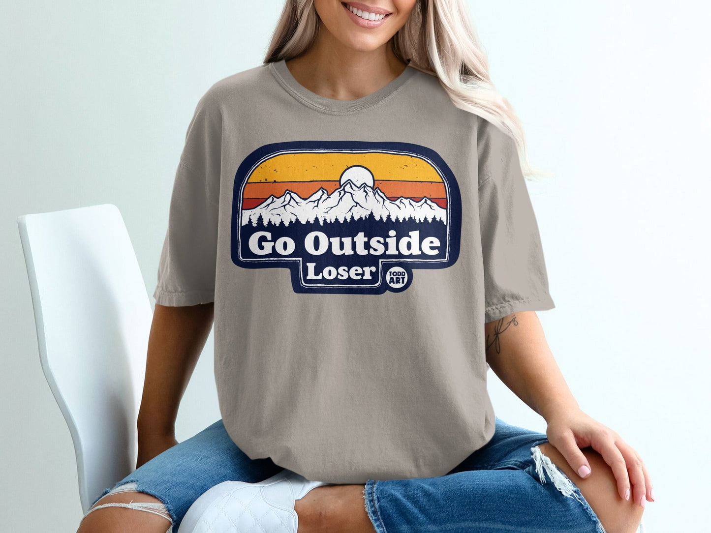 T-shirt with "Go Outside Loser" mountain sunset graphic and "Food Art" logo.