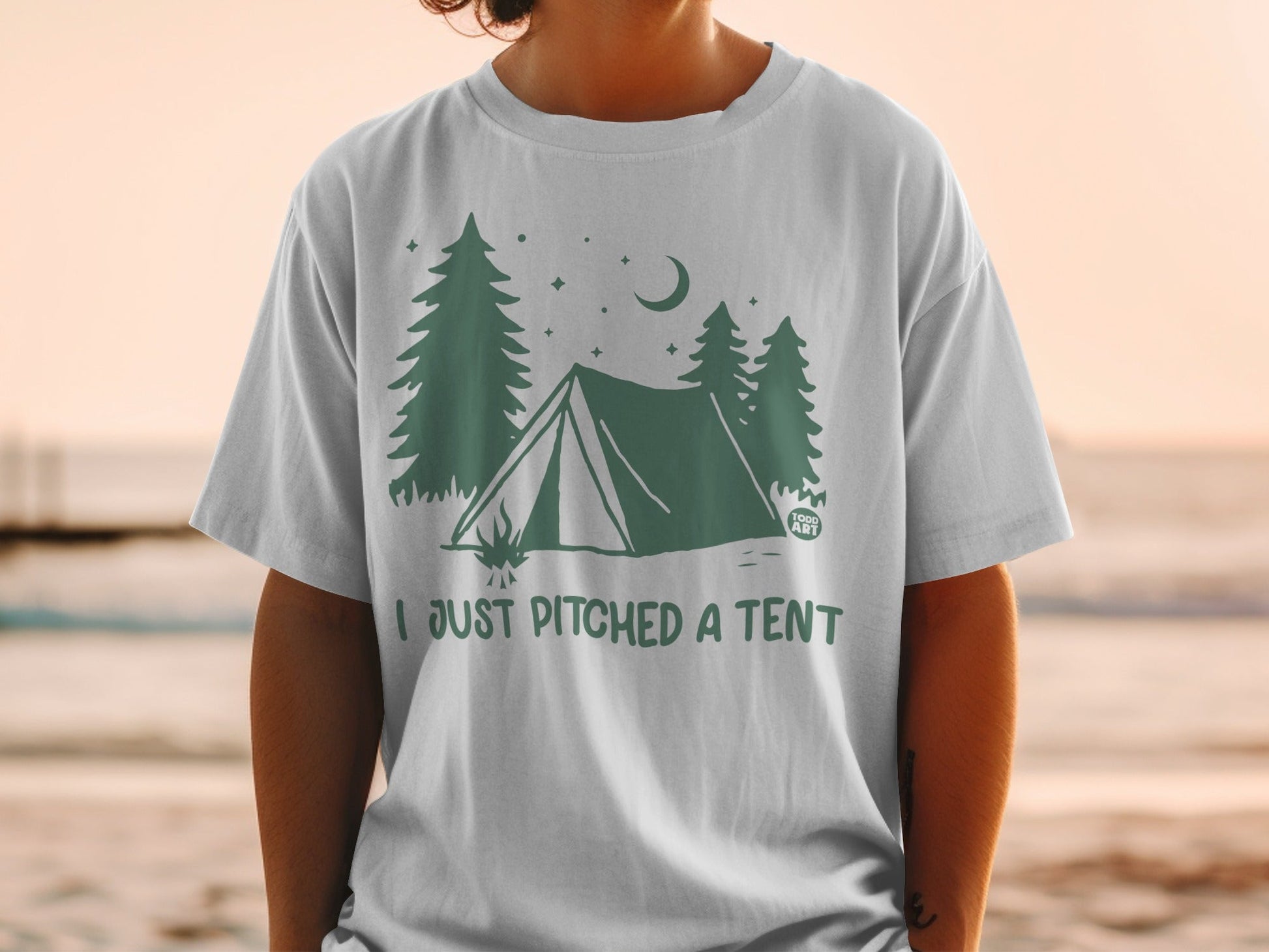Green tent illustration with trees and moon, text "I JUST PITCHED A TENT".