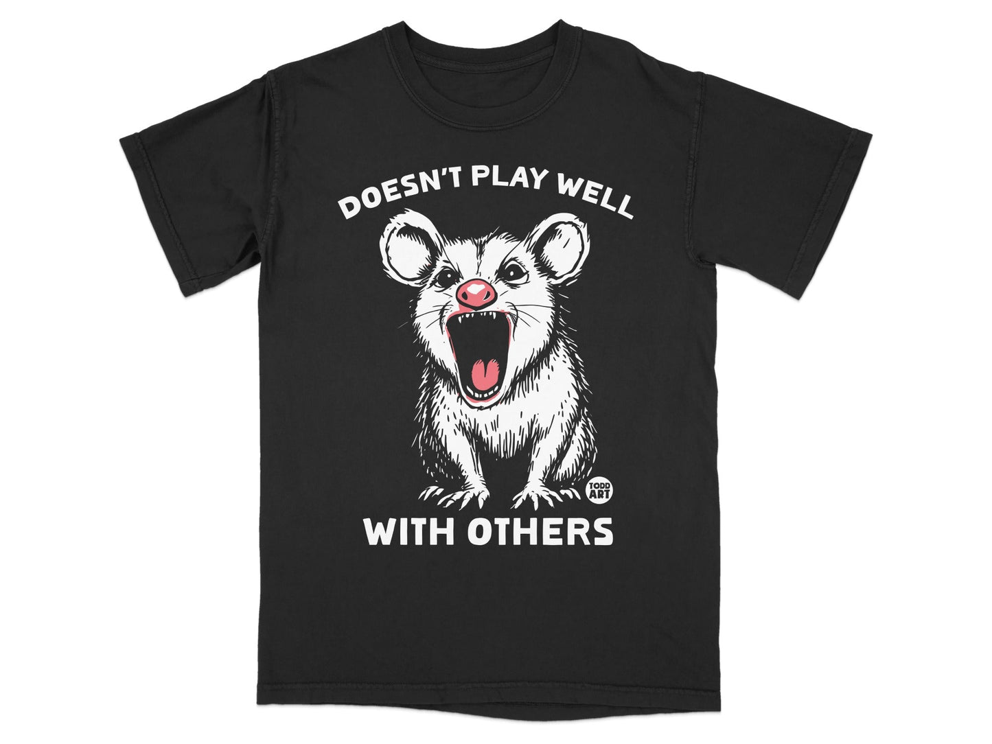 Black t-shirt with a cartoon possum graphic and "Doesn't Play Well With Others" text.