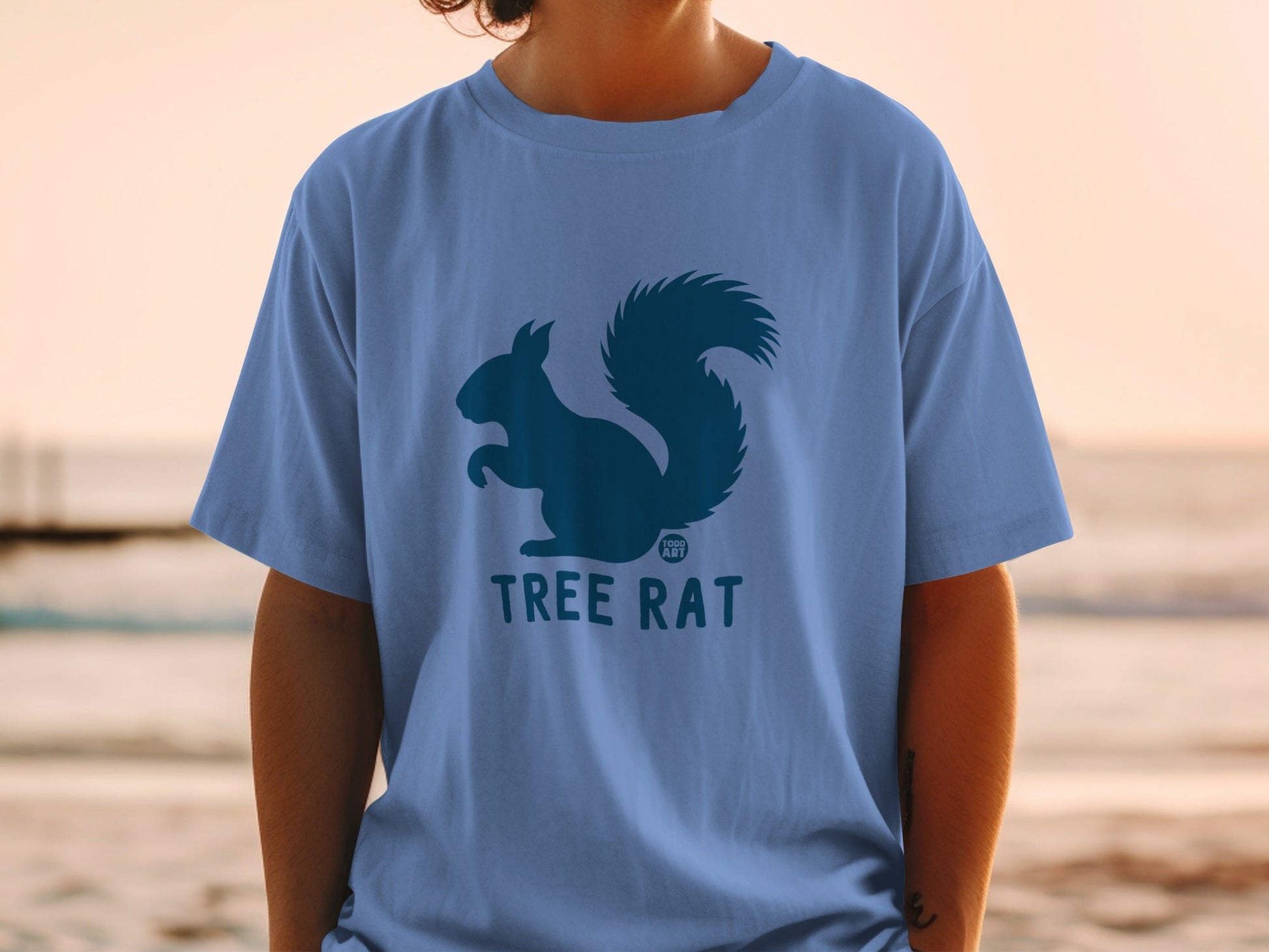 Blue t-shirt with dark blue squirrel and "Tree Rat" logo.