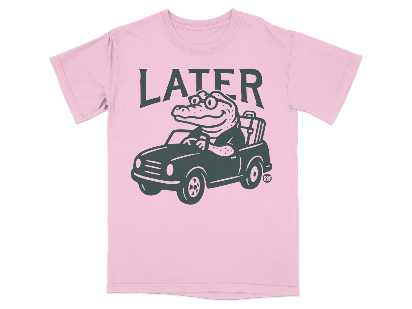 Pink t-shirt with a cartoon alligator driving a car, text "LATER".