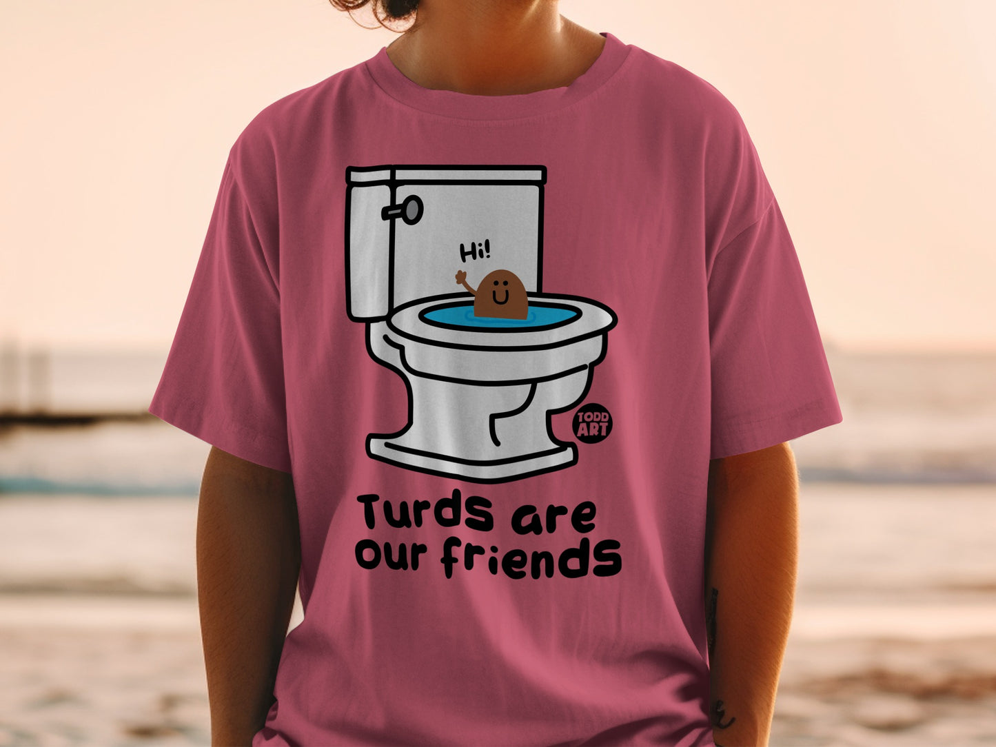 Pink t-shirt with cartoon poop in toilet saying "Hi!" and text "Turds are our friends."