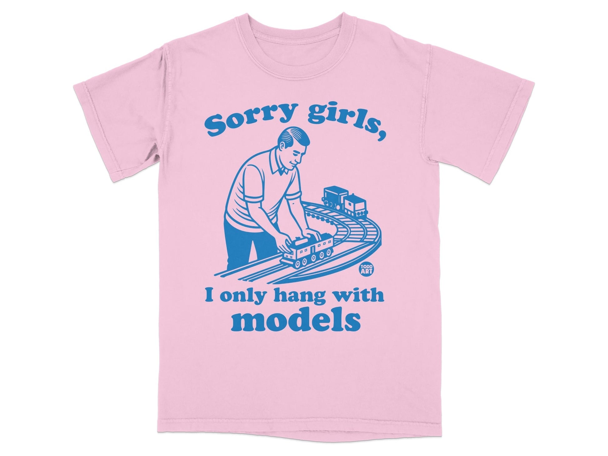 Pink t-shirt with blue text reading "Sorry girls, I only hang with models" and a graphic of a man with toy trains.