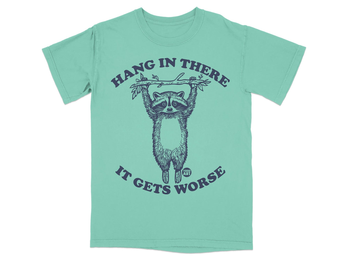 T-shirt with raccoon hanging from branch, "Hang in there it gets worse" text.