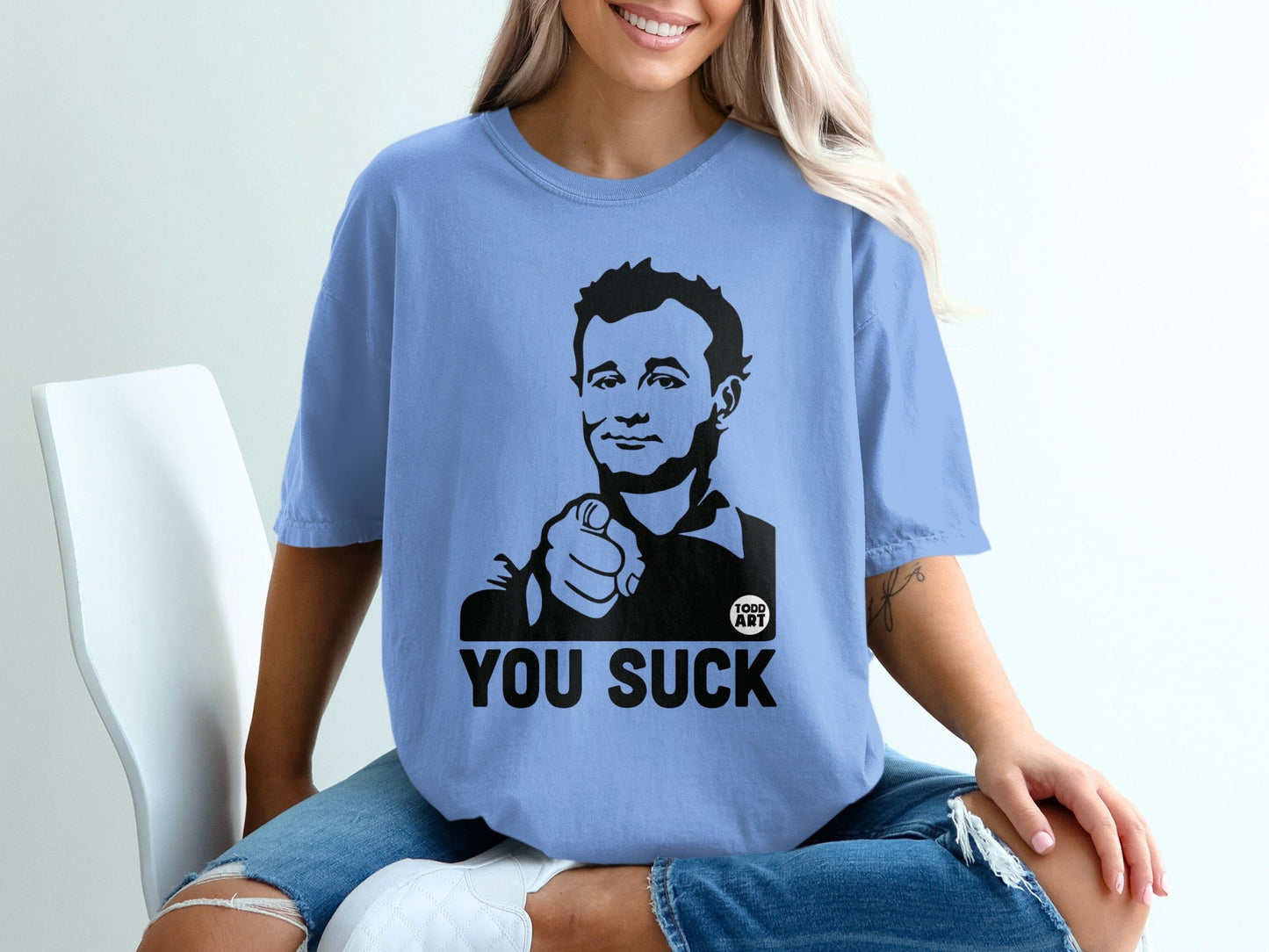 Light blue t-shirt with Bill Murray pointing and "YOU SUCK" text.