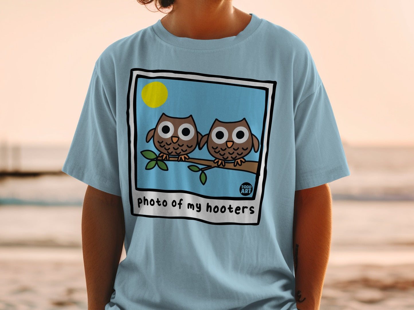 Two cartoon owls sitting on a branch with "photo of my hooters" text.