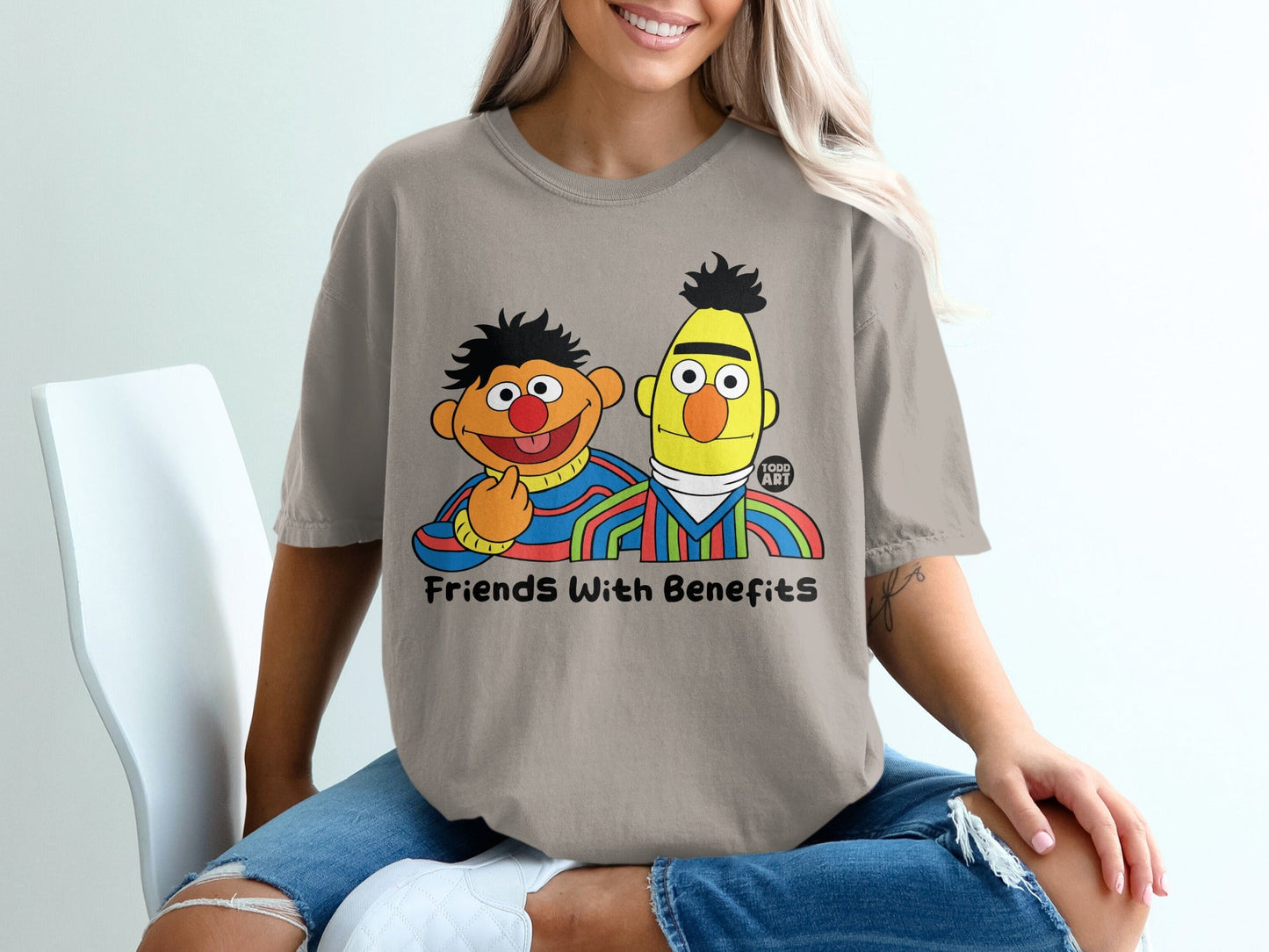 Sesame Street's Bert and Ernie on a taupe t-shirt with "Friends With Benefits" text.