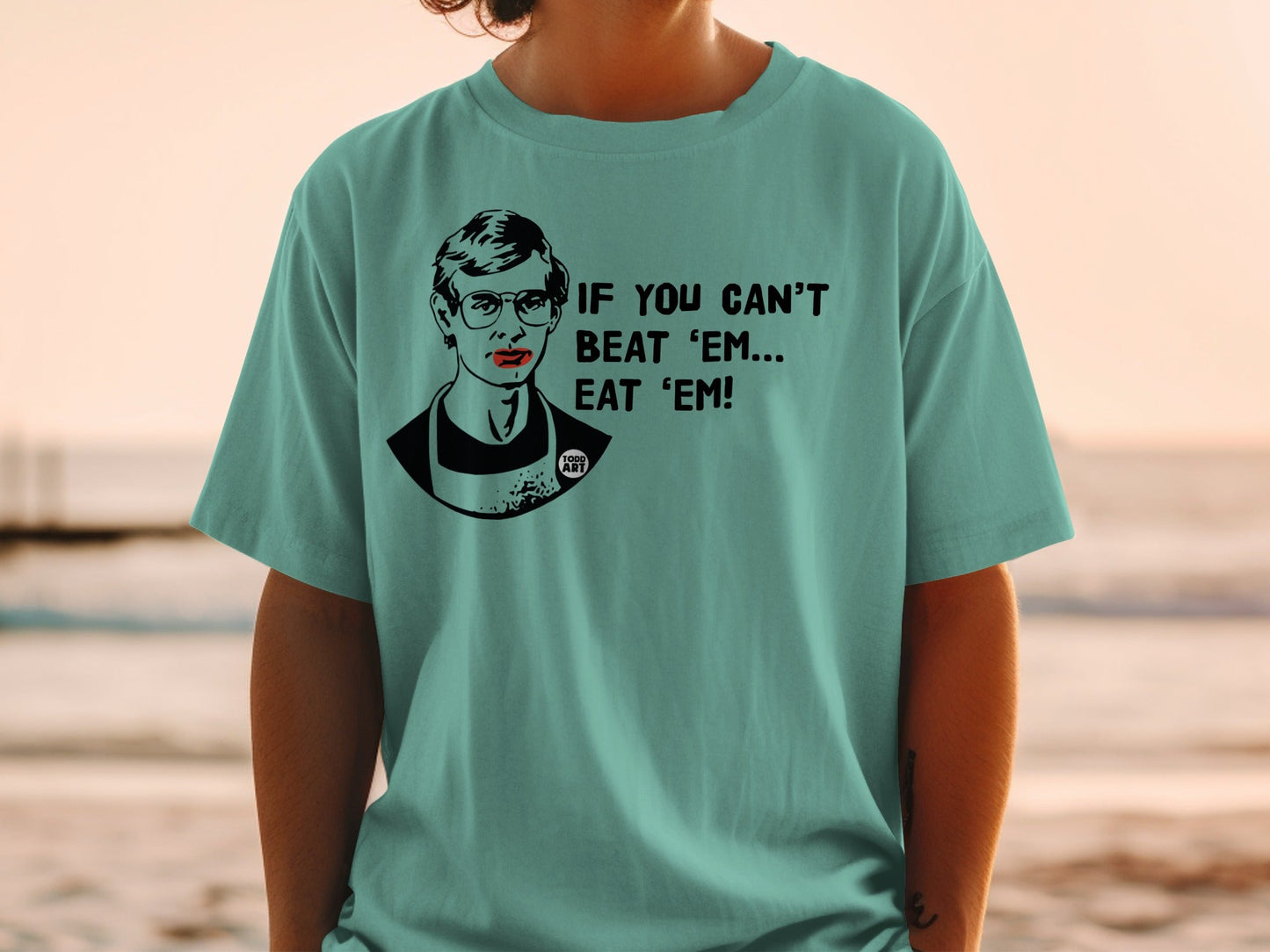 T-shirt with portrait and text "IF YOU CAN'T BEAT 'EM... EAT 'EM!".