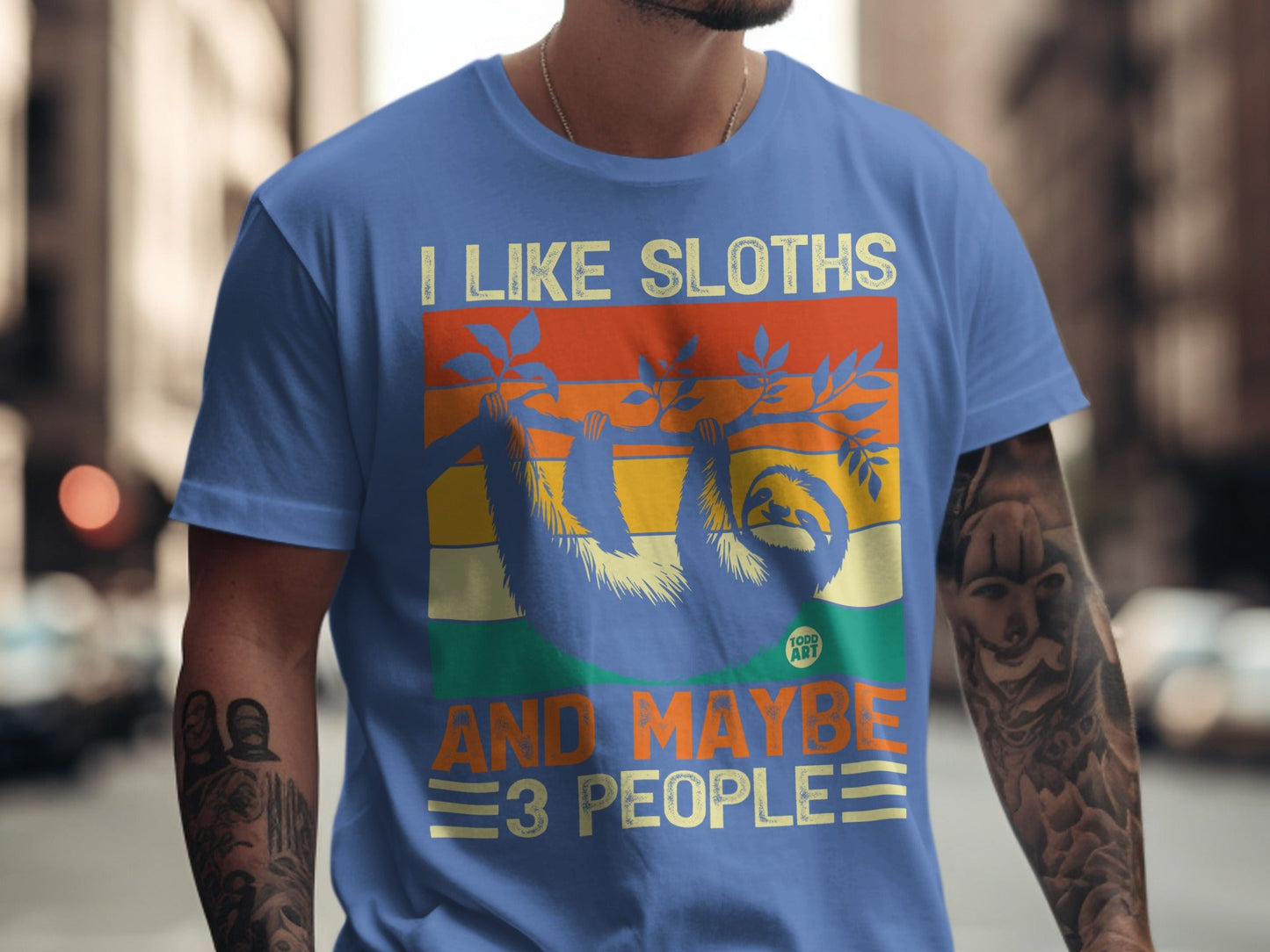 Blue t-shirt with "I Like Sloths And Maybe 3 People" text and sloth graphic.