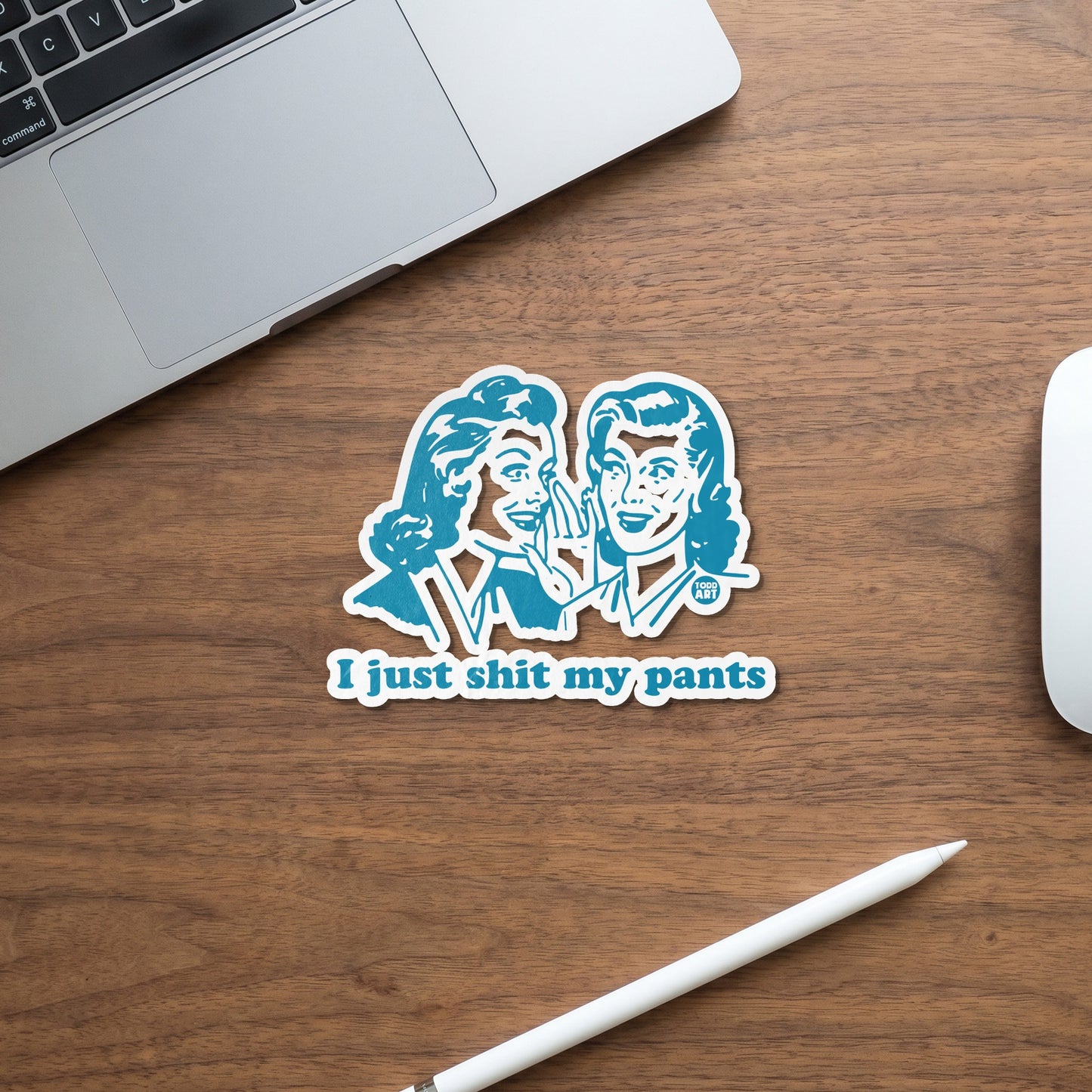 Turquoise sticker with two women whispering and text "I just shit my pants".