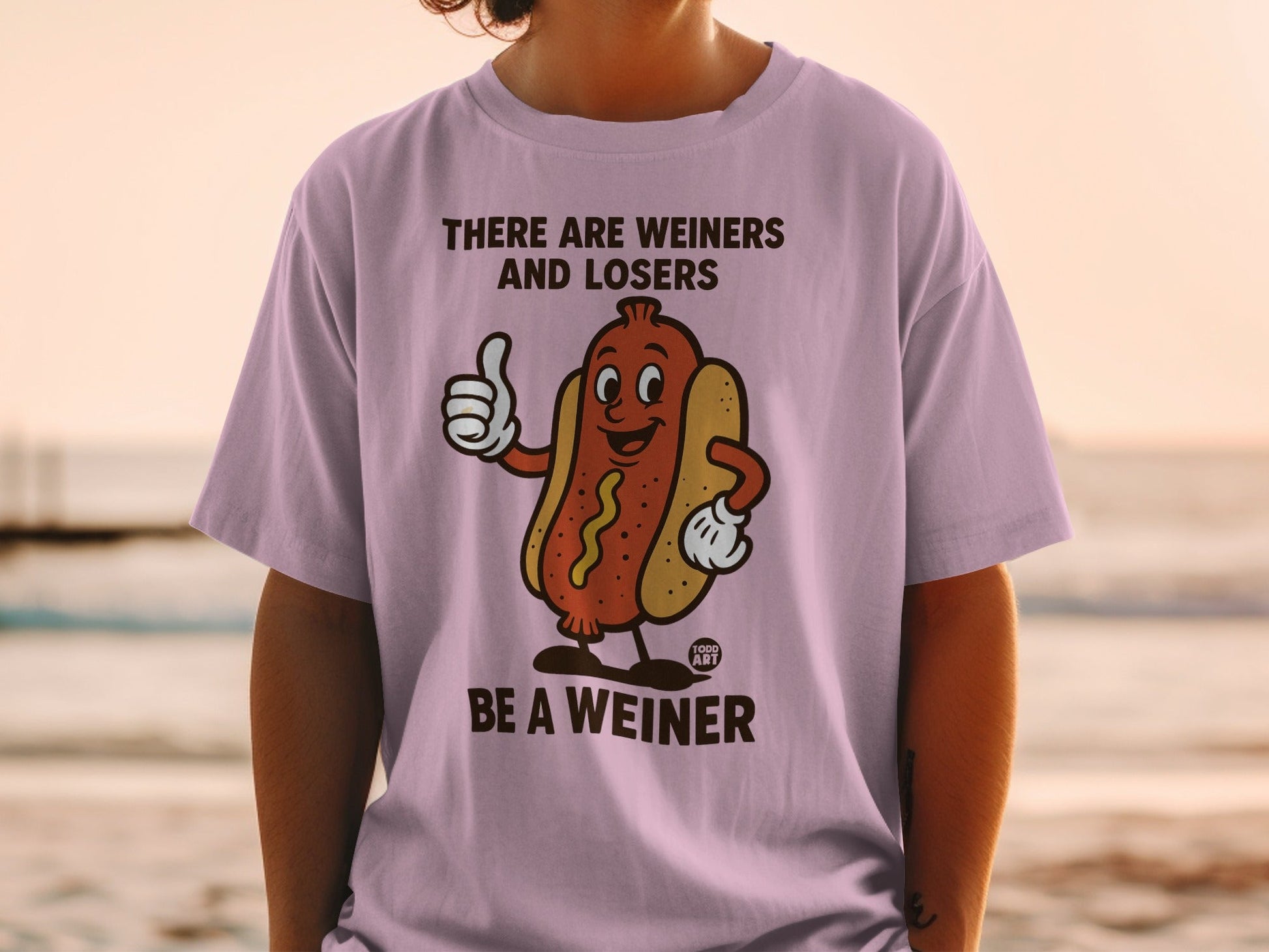 T-shirt with cartoon hot dog giving thumbs up, "THERE ARE WEINERS AND LOSERS BE A WEINER".