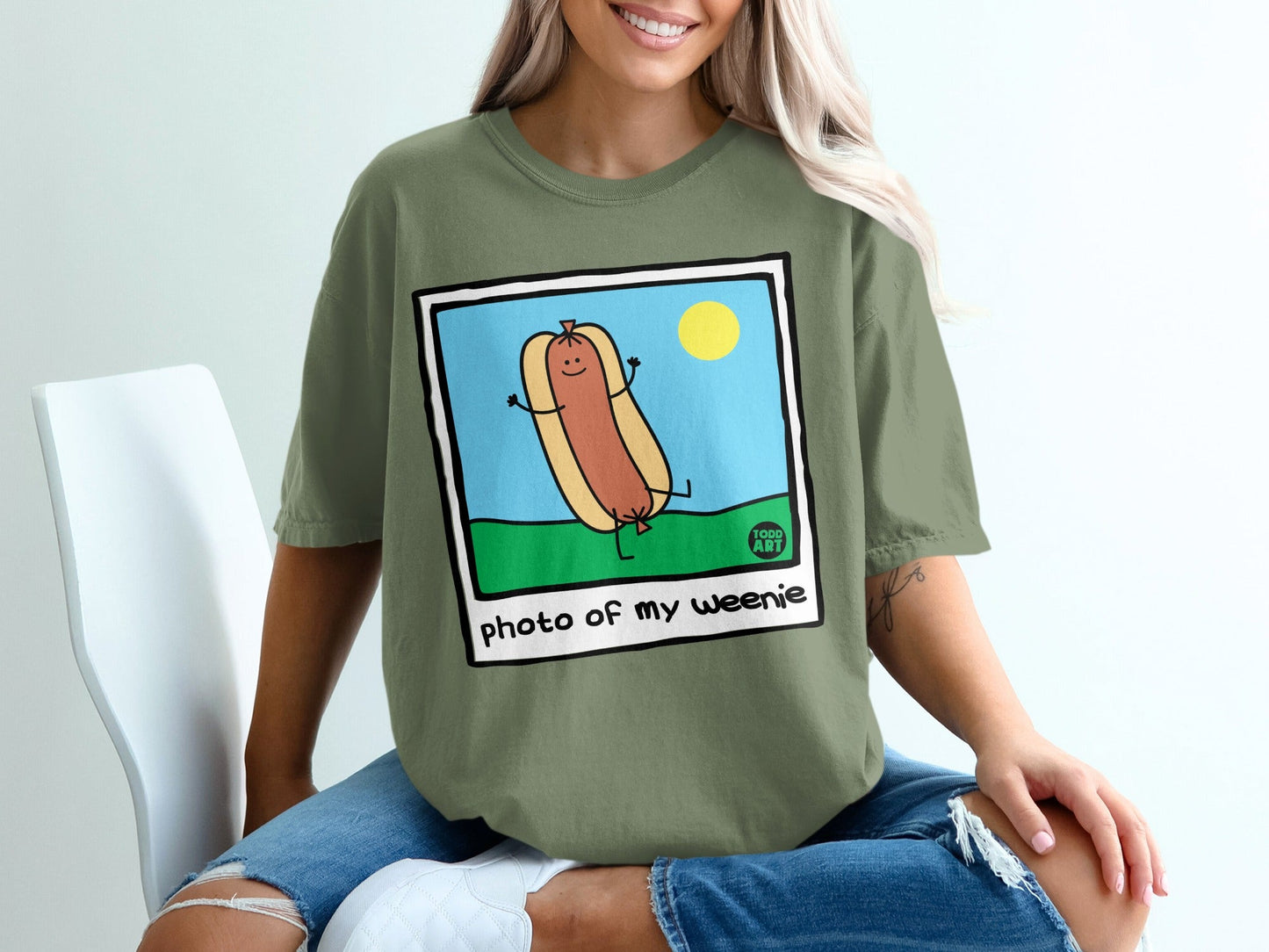 Cartoon hot dog with arms and legs, "photo of my weenie" text.