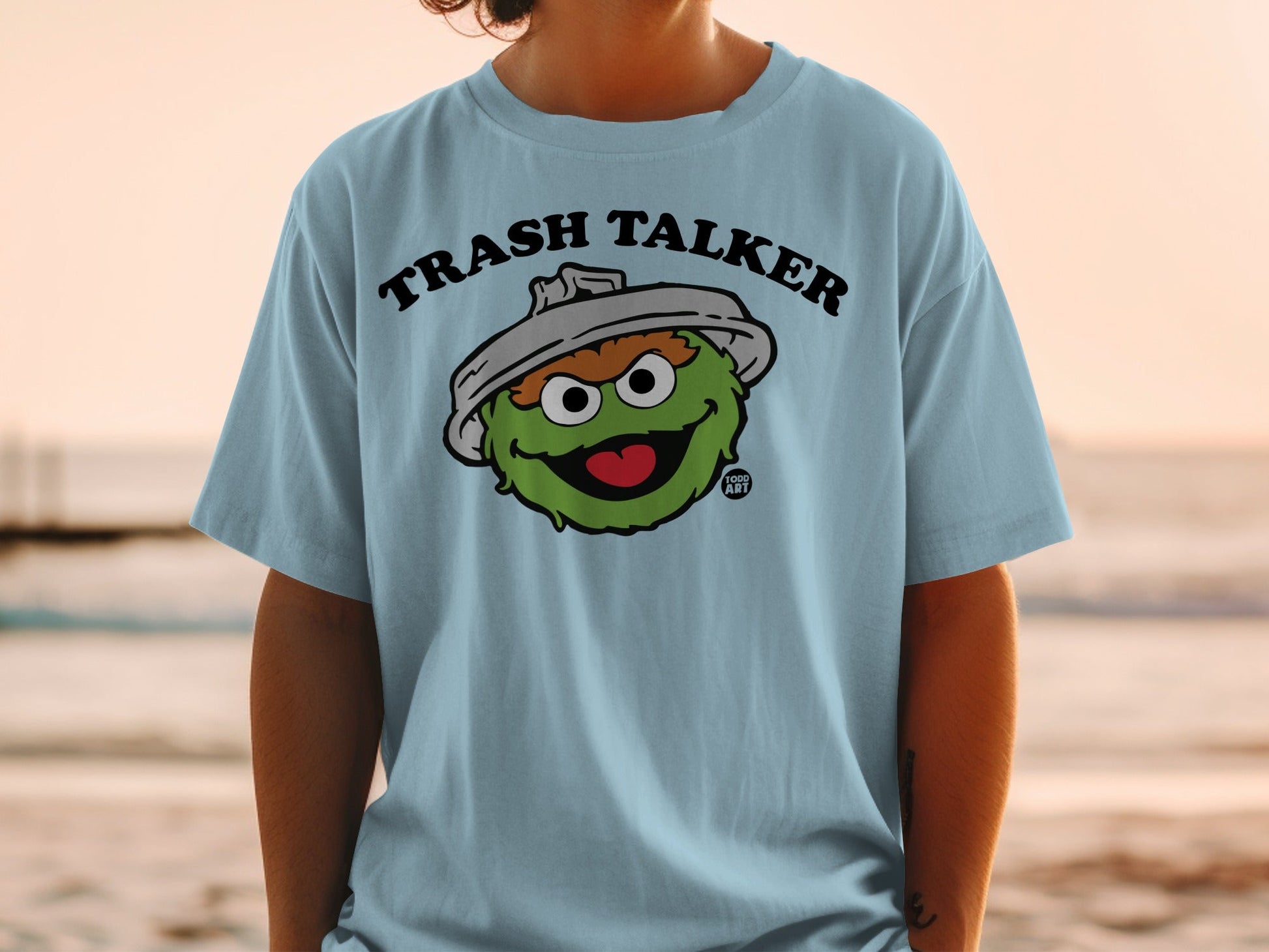 Light blue t-shirt with Oscar the Grouch, "Trash Talker" text.