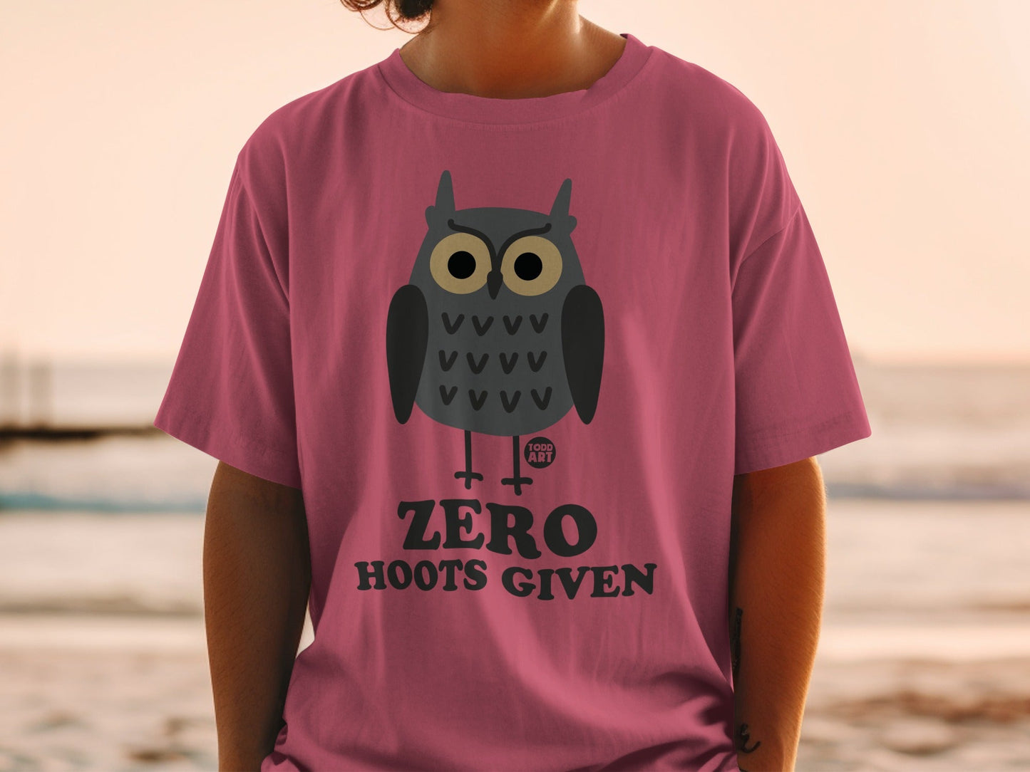 Pink t-shirt with cartoon owl graphic and "ZERO HOOTS GIVEN" text.